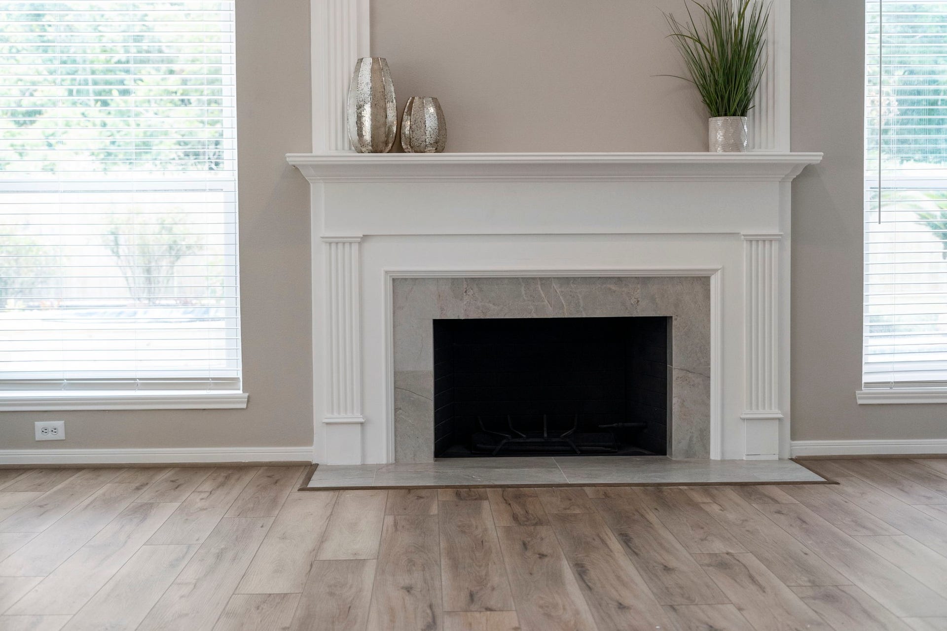 75 Stalybridge Street, Sugar Land, TX 77479 The spacious family room centers around a beautifully remodeled fireplace, framed by windows overlooking the backyard.