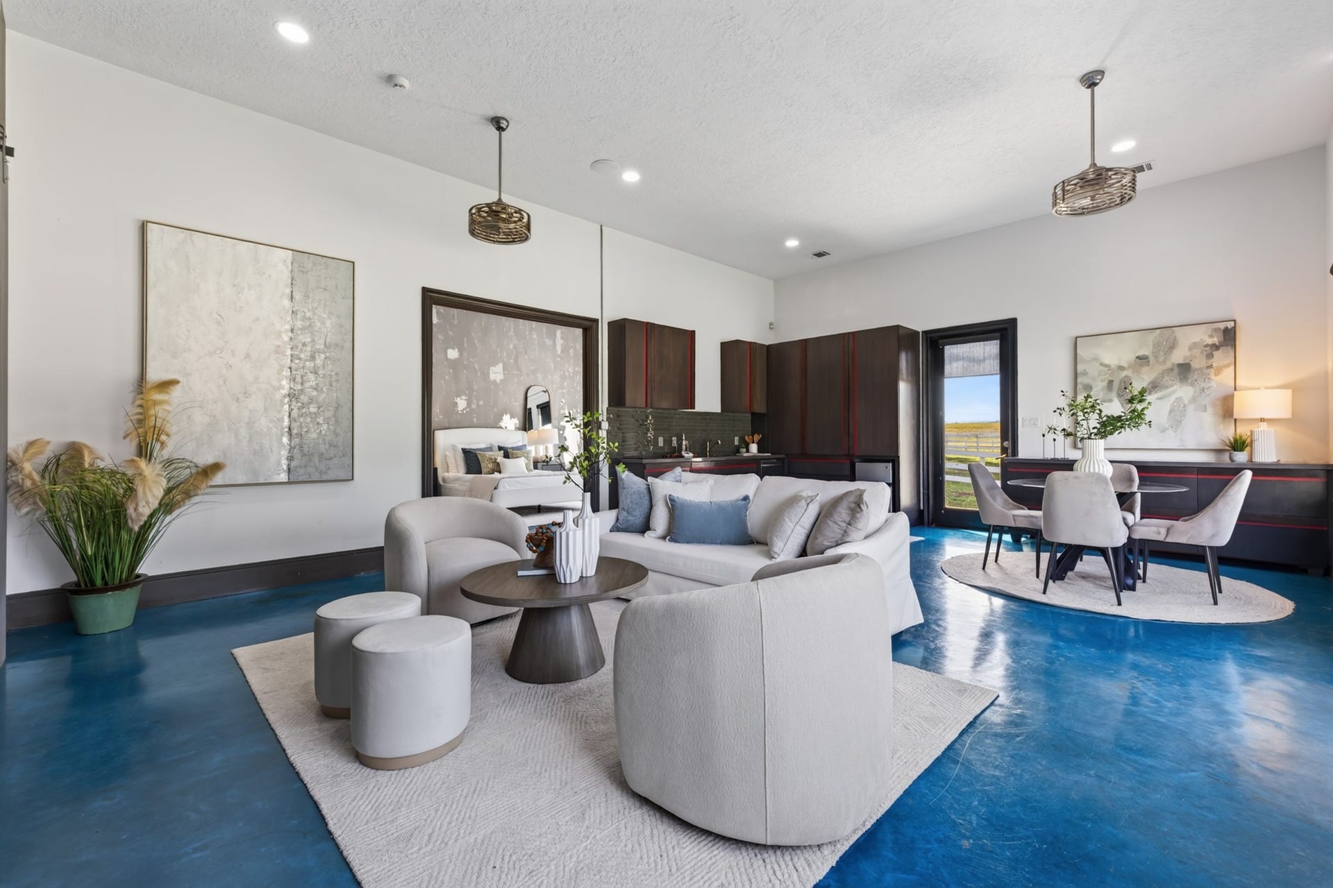 24005 Old Dobbin Plantersville Road, Montgomery, TX 77316 Bold blue floors give the Guest Quarters' gathering space a joyful, unforgettable personality.