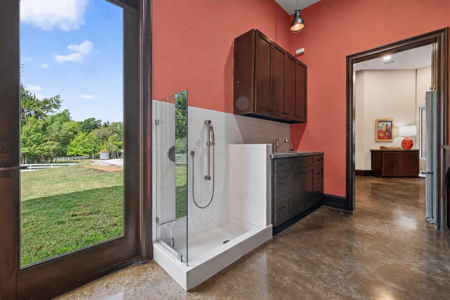 24005 Old Dobbin Plantersville Road, Montgomery, TX 77316 A dedicated pet-washing station adds thoughtful luxury for the family's four-legged companions.