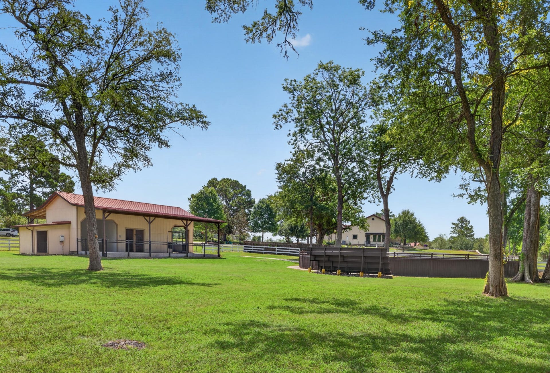 24005 Old Dobbin Plantersville Road, Montgomery, TX 77316 From shaded bleachers, watch children and grandchildren grow confident in the saddle beneath the oak.