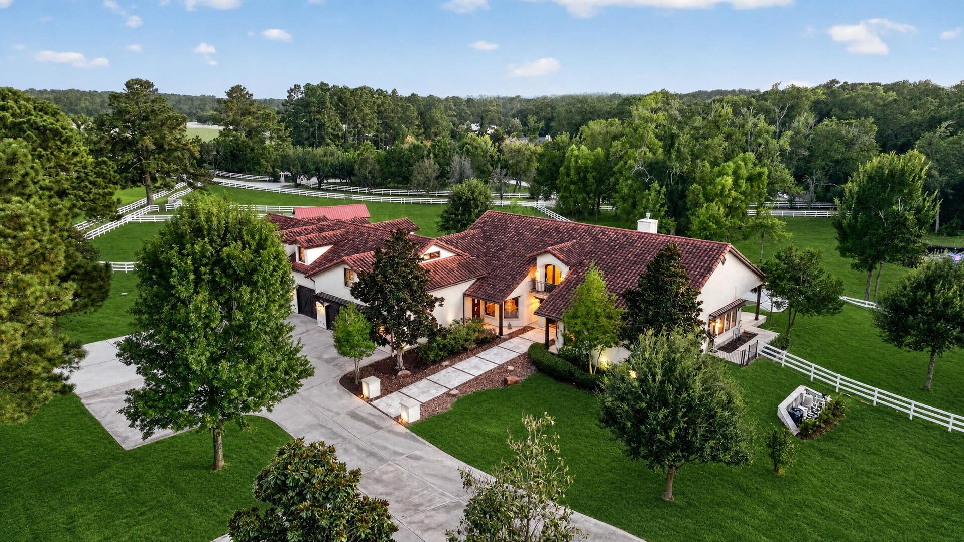 24005 Old Dobbin Plantersville Road, Montgomery, TX 77316 A sweeping circular drive reveals a thoughtfully planned custom home surrounded by mature trees.