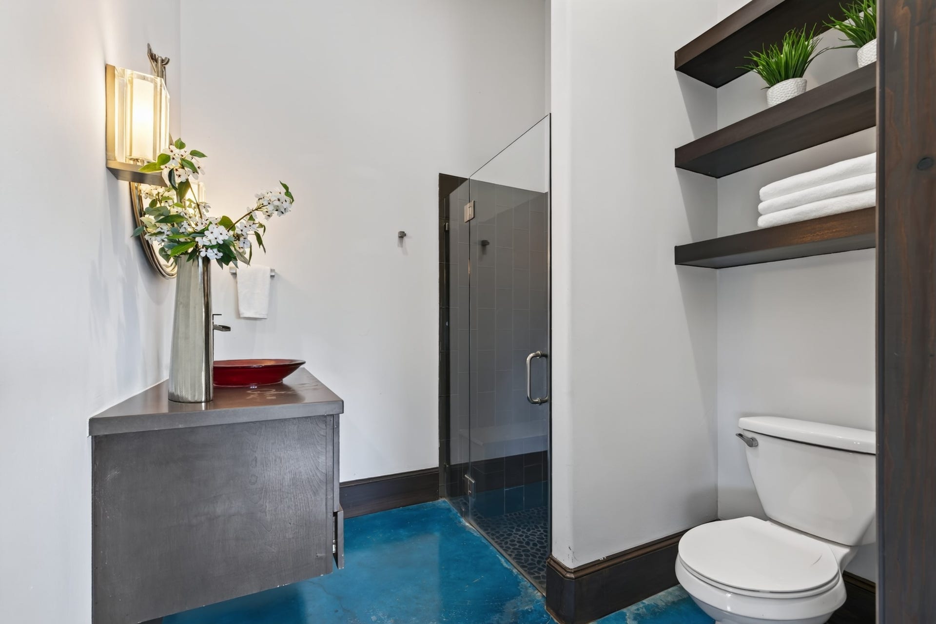 24005 Old Dobbin Plantersville Road, Montgomery, TX 77316 A walk-in shower and thoughtful storage complete this comfortable private guest retreat.
