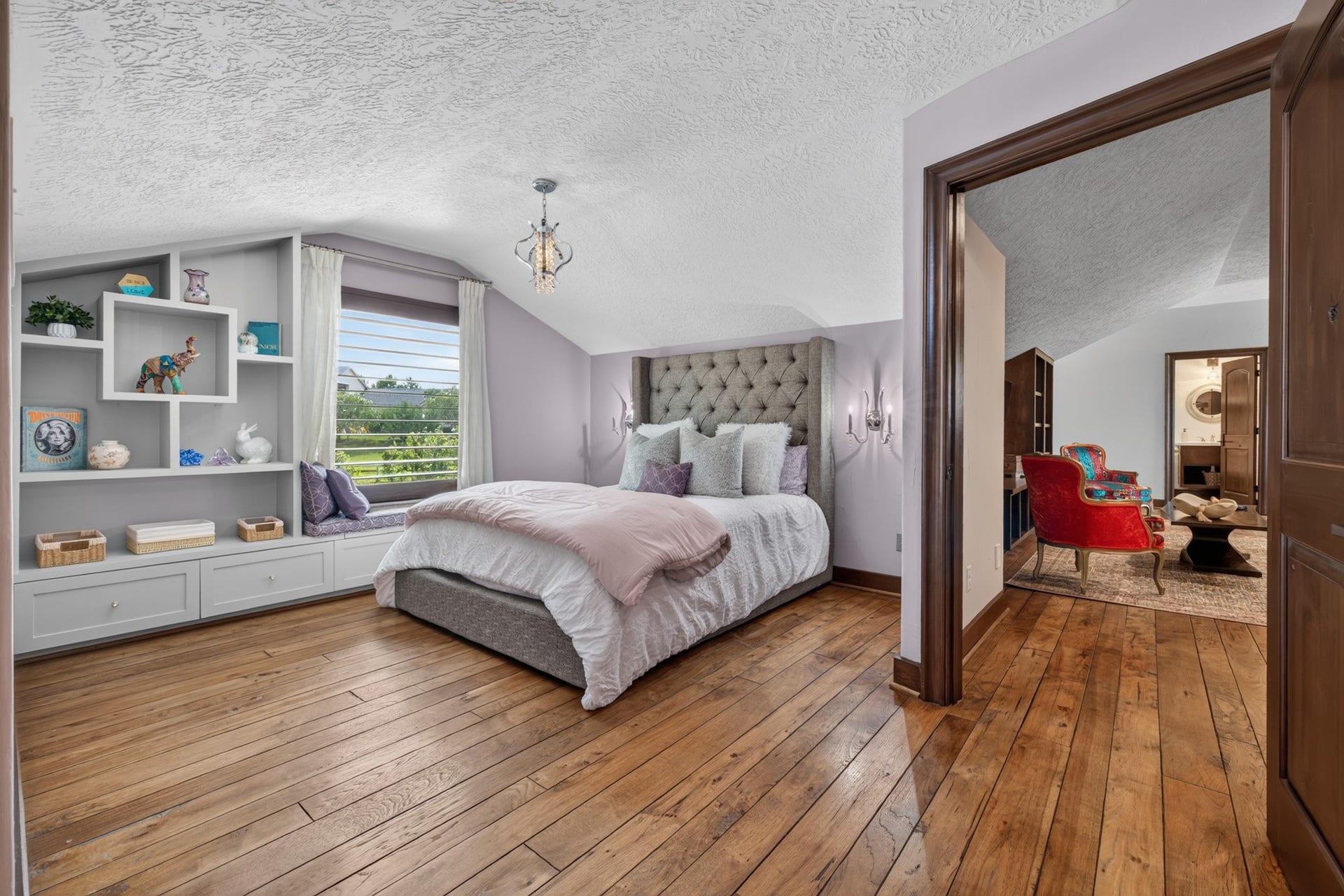 24005 Old Dobbin Plantersville Road, Montgomery, TX 77316 A peaceful secondary bedroom offers built-in storage, natural light and restful countryside views.