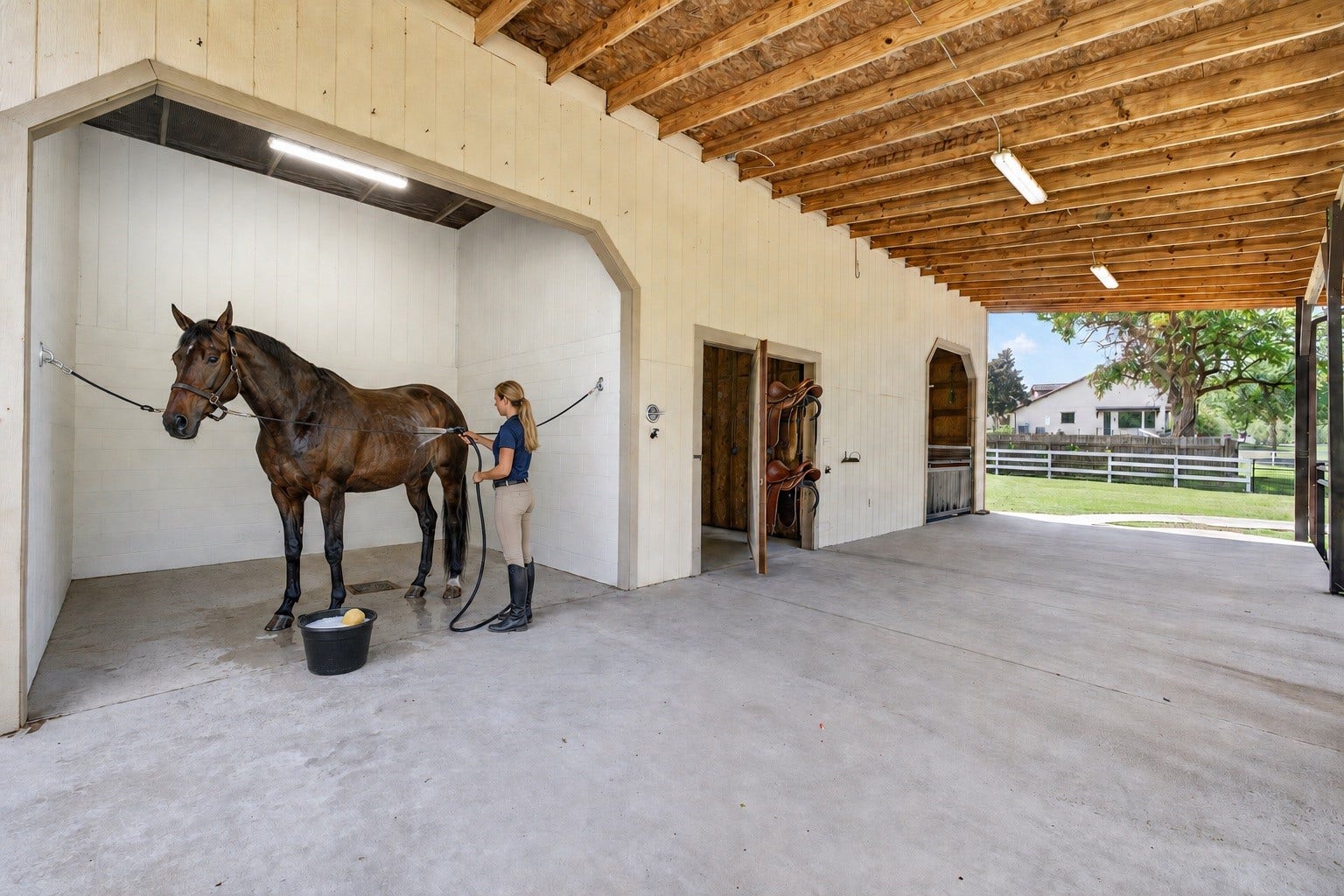 24005 Old Dobbin Plantersville Road, Montgomery, TX 77316 The covered stable area keeps horses close, comfortable and part of everyday family life.