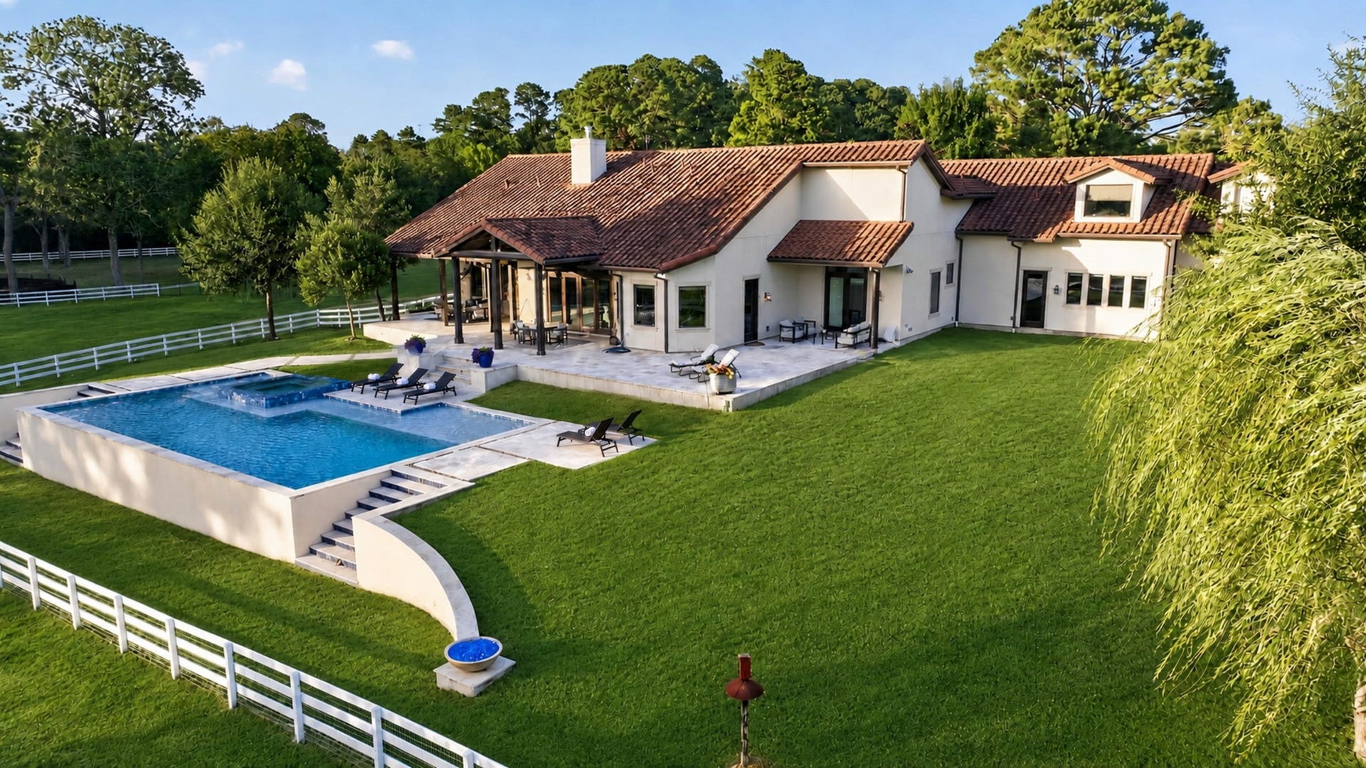 24005 Old Dobbin Plantersville Road, Montgomery, TX 77316 From above, pool, spa and broad lawn flow together like a private resort.