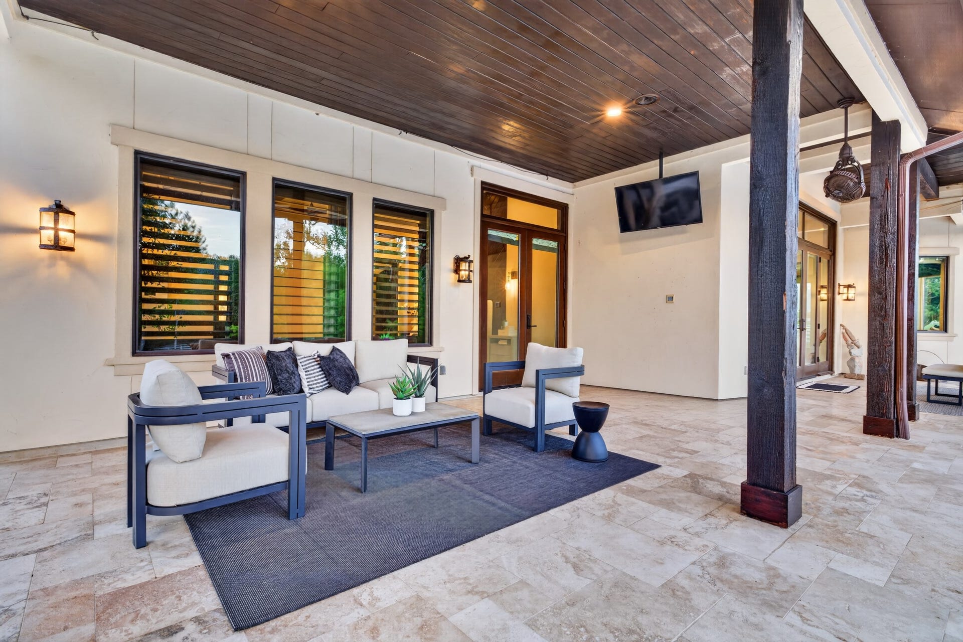 24005 Old Dobbin Plantersville Road, Montgomery, TX 77316 A private covered retreat off the primary suite offers shade, serenity and views across the grounds.