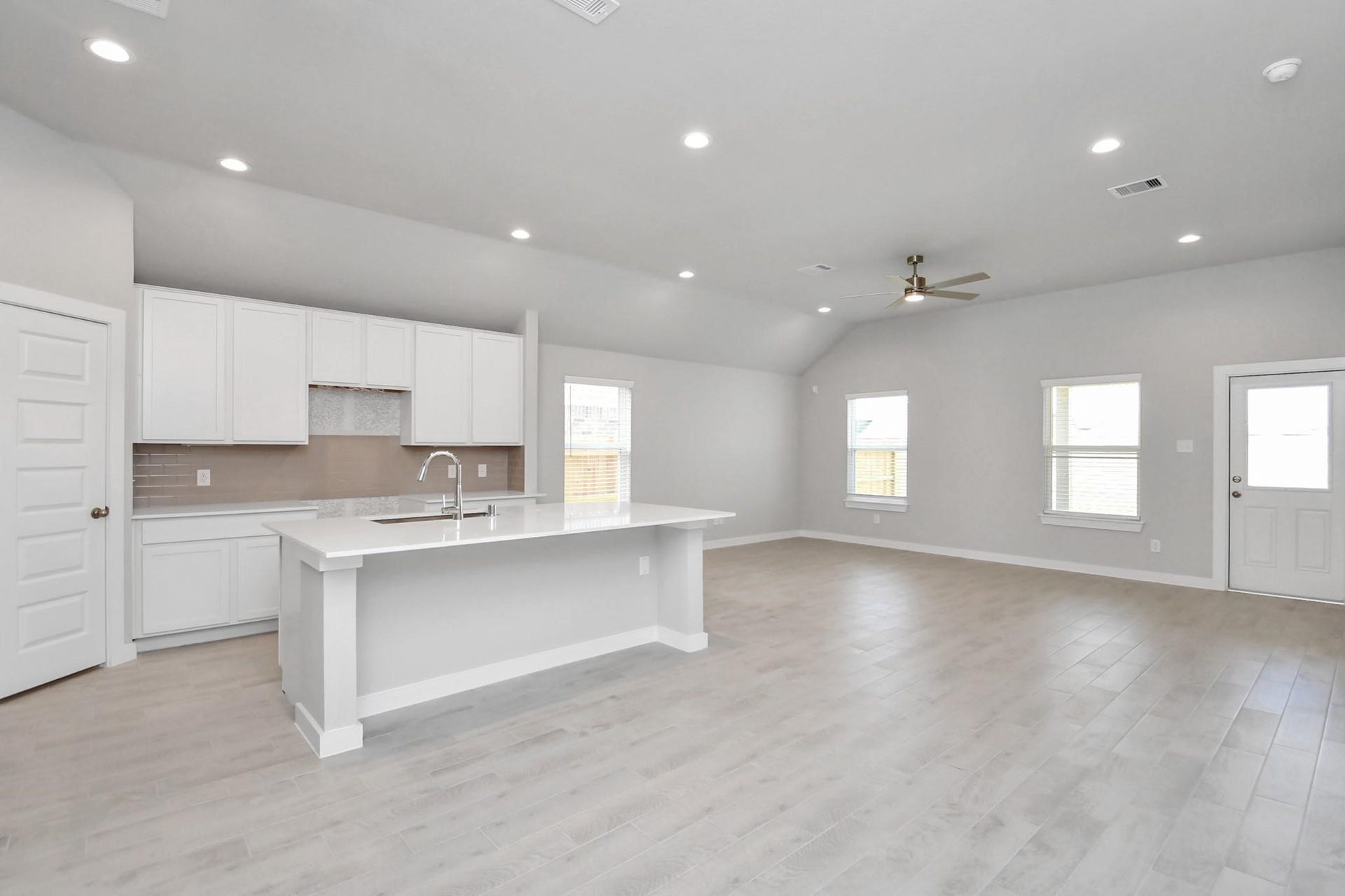 15611 Kirkton Raye Drive, Humble, TX 77346 Spacious kitchen with large island, granite countertops, and white cabinets,