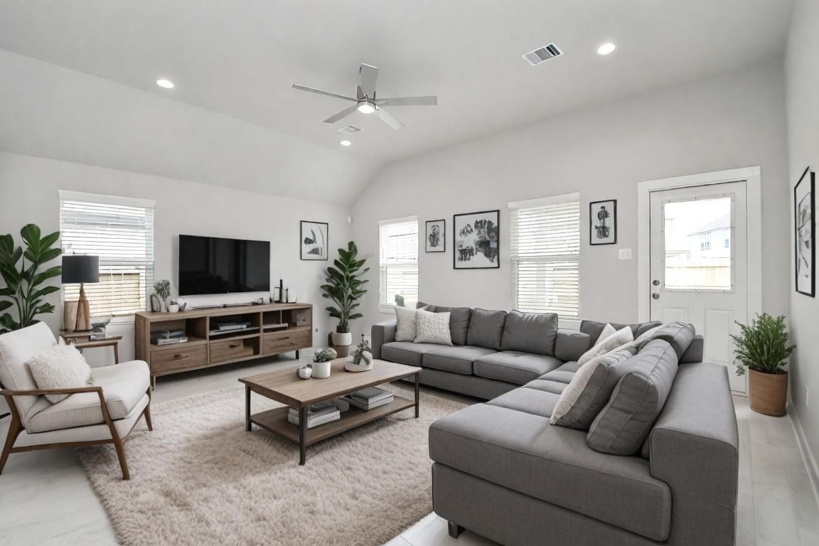 15611 Kirkton Raye Drive, Humble, TX 77346 The living room offers a bright and inviting space, perfect for stylish and comfortable living. This room is virtually staged.
