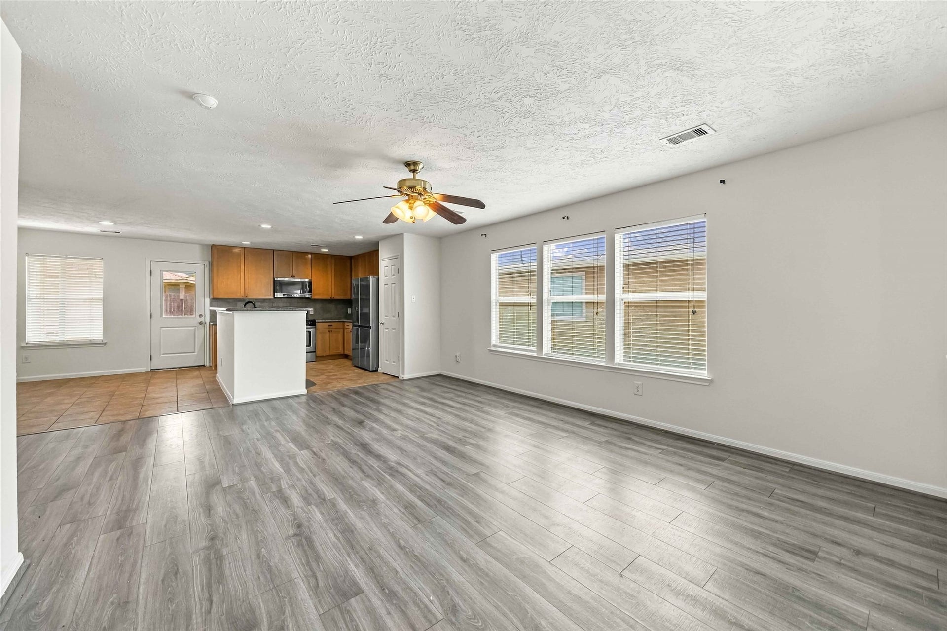 16011 Arapaho Bend Lane, Cypress, TX 77429 Living room has 3 big windows