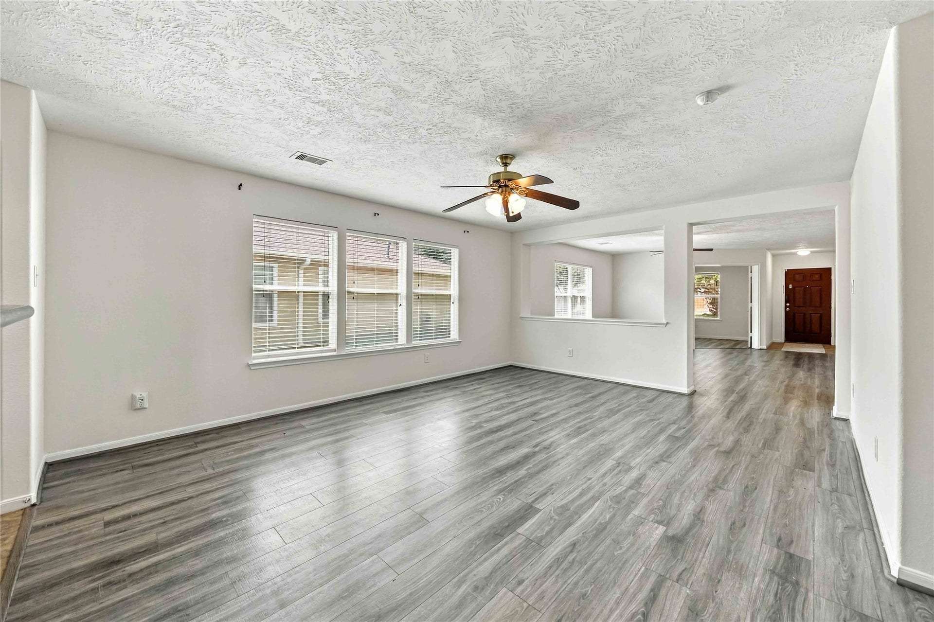 16011 Arapaho Bend Lane, Cypress, TX 77429 Living room - Dining room - then home office filled with natural light