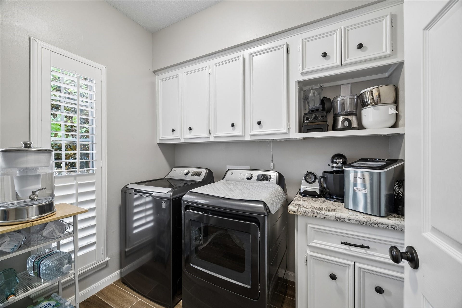 2411 Kings Lodge Drive, Kingwood, TX 77345 Roomy laundry room, with spot for extra fridge, has great lighting from a nice bright window.