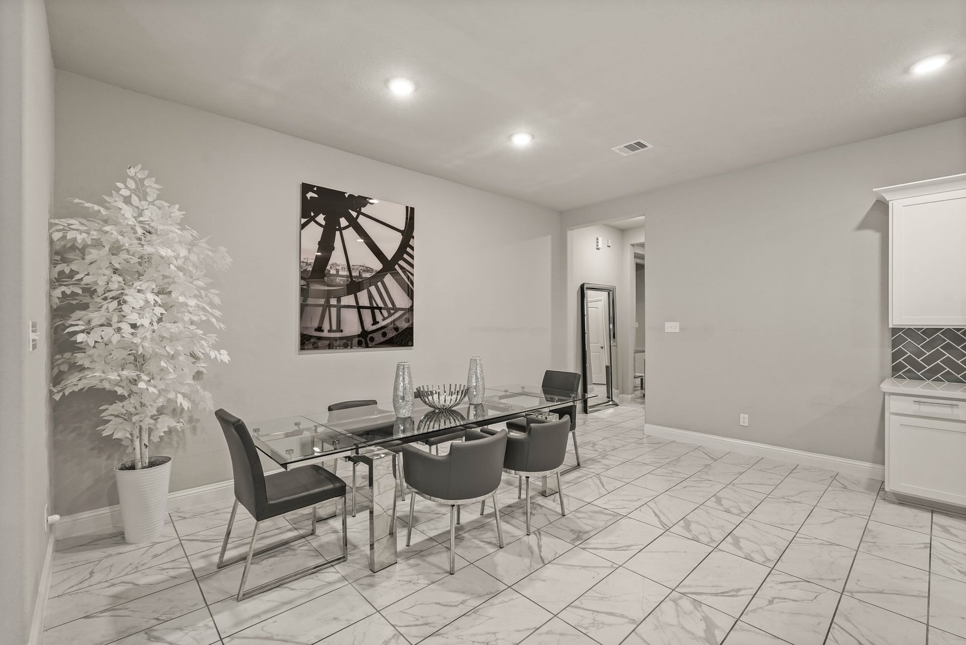1710 Forest Mist Drive, Missouri City, TX 77459 A look at the dedicated dining zone, emphasizing the home's spacious and interconnected floor plan. The area is highlighted by its clean lines, and bright overhead lighting. Sitting adjacent to the kitchen workspace, this versatile room offers plenty of layout flexibility for family meals
while remaining open to the rest of the main floor.