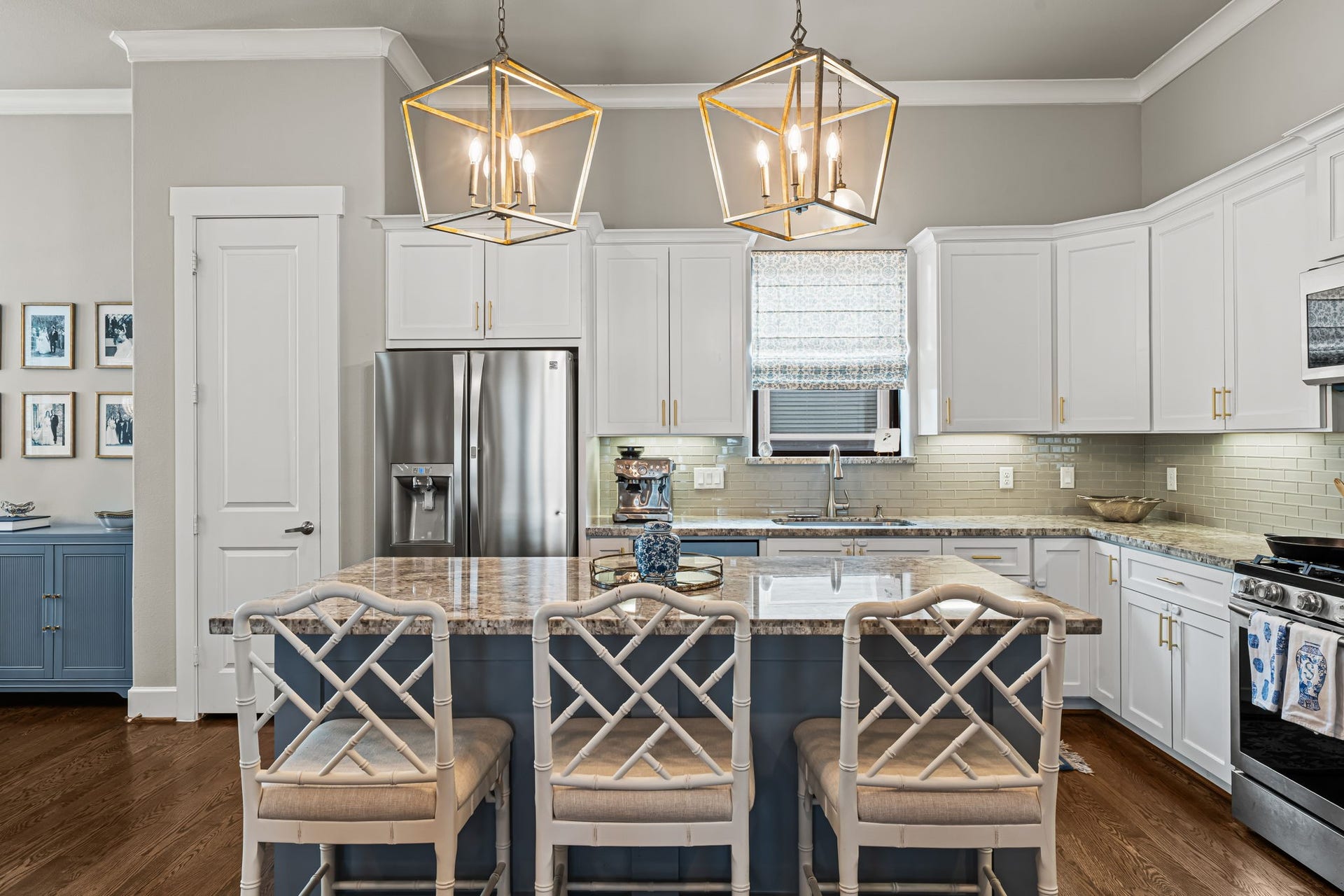 868 Wakefield Drive, #B, Houston, TX 77018 Lantern pendants cast a warm glow over the island, while a window above the sink brightens the kitchen.