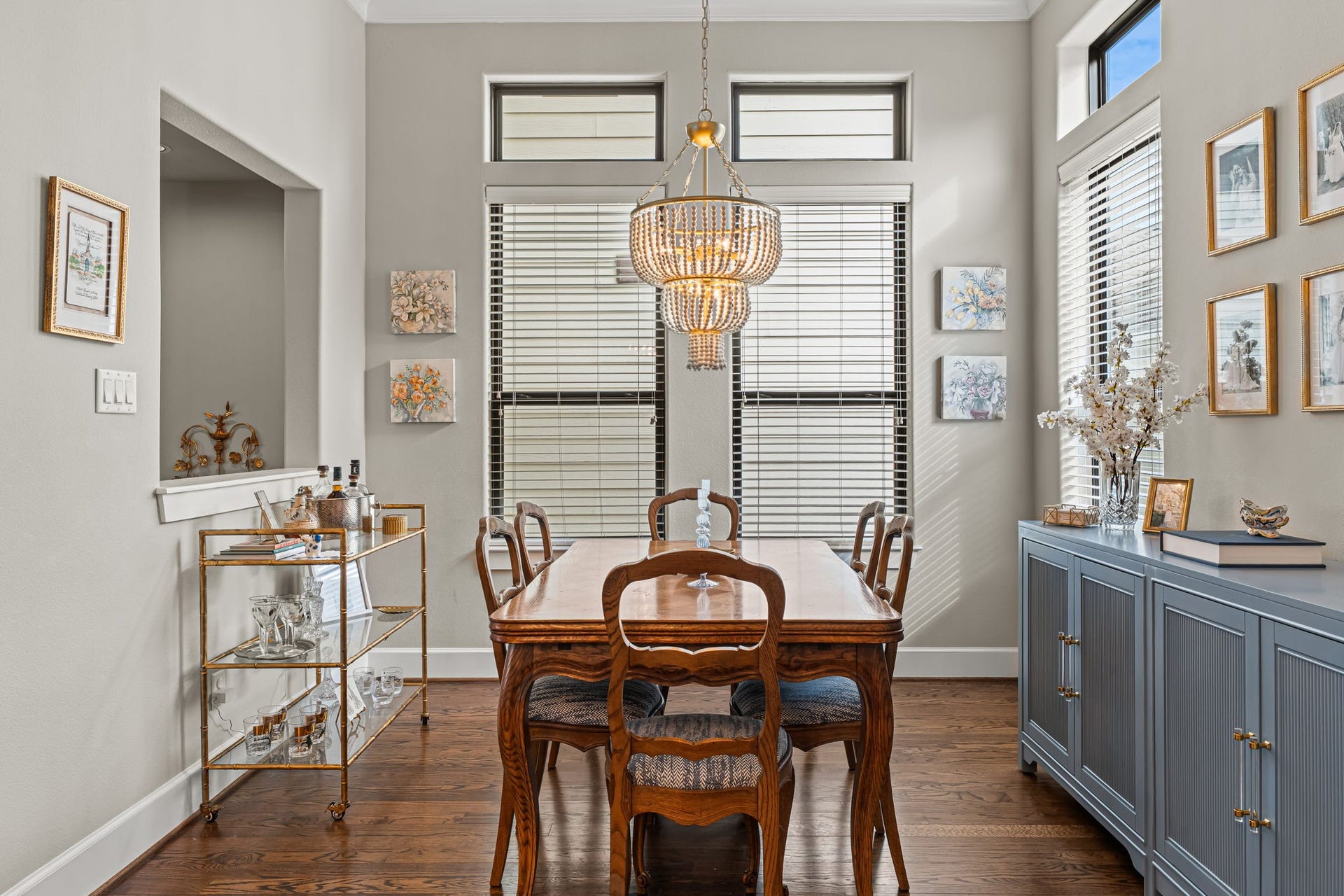 868 Wakefield Drive, #B, Houston, TX 77018 A window-lined corner makes dining room feel bright and intimate. Crown molding traces the ceiling above, lending everyday meals a sense of occasion.