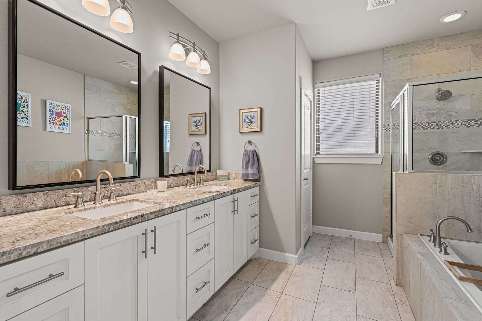 868 Wakefield Drive, #B, Houston, TX 77018 A soaking tub and separate glass-enclosed shower invite an unhurried daily ritual in the primary bath. A long double vanity provides ample space for two to prepare with ease.