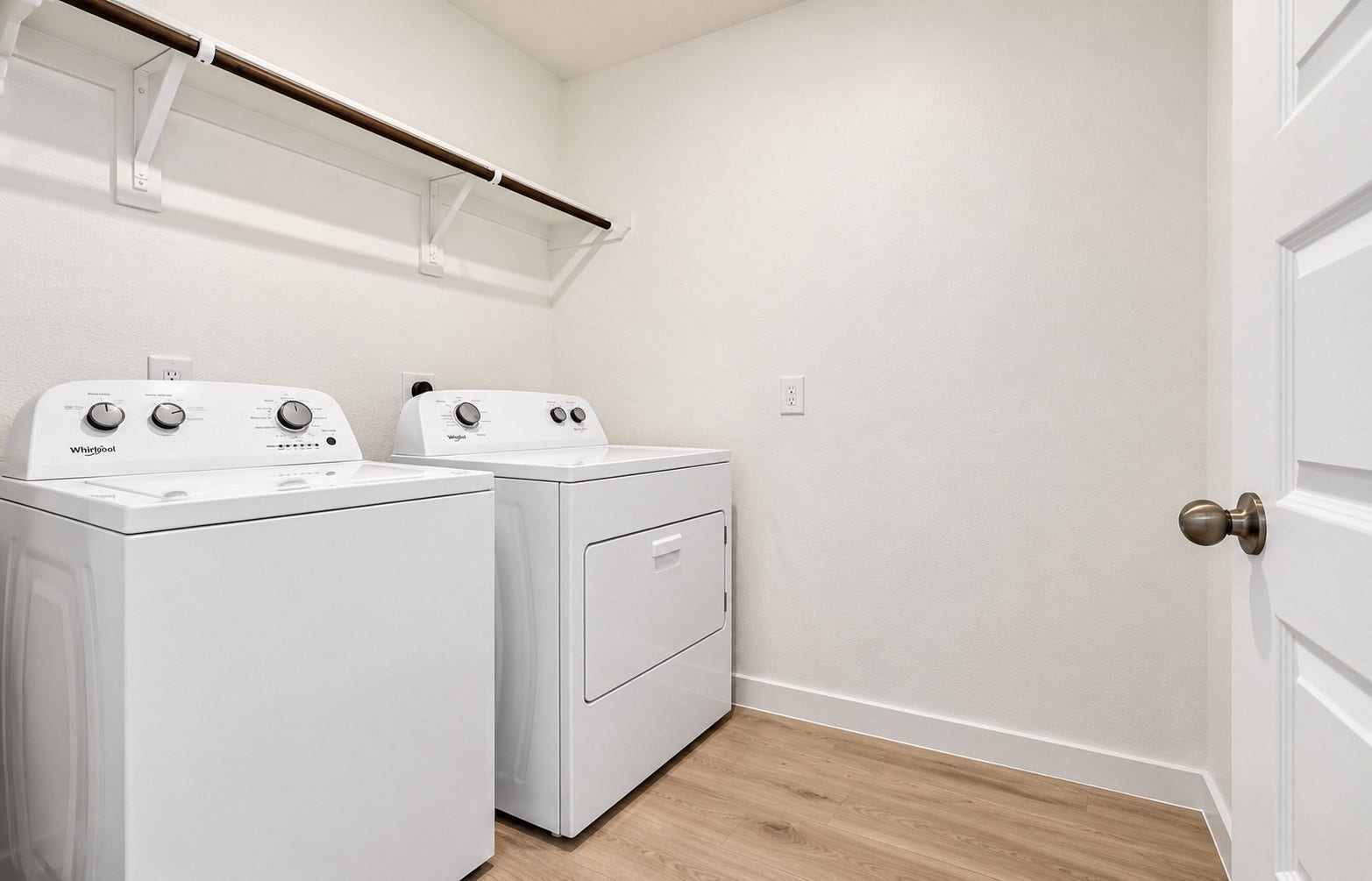 31742 Margaret Woods Lane, Fulshear, TX 77441 Laundry room, washer/ dryer and shelving.