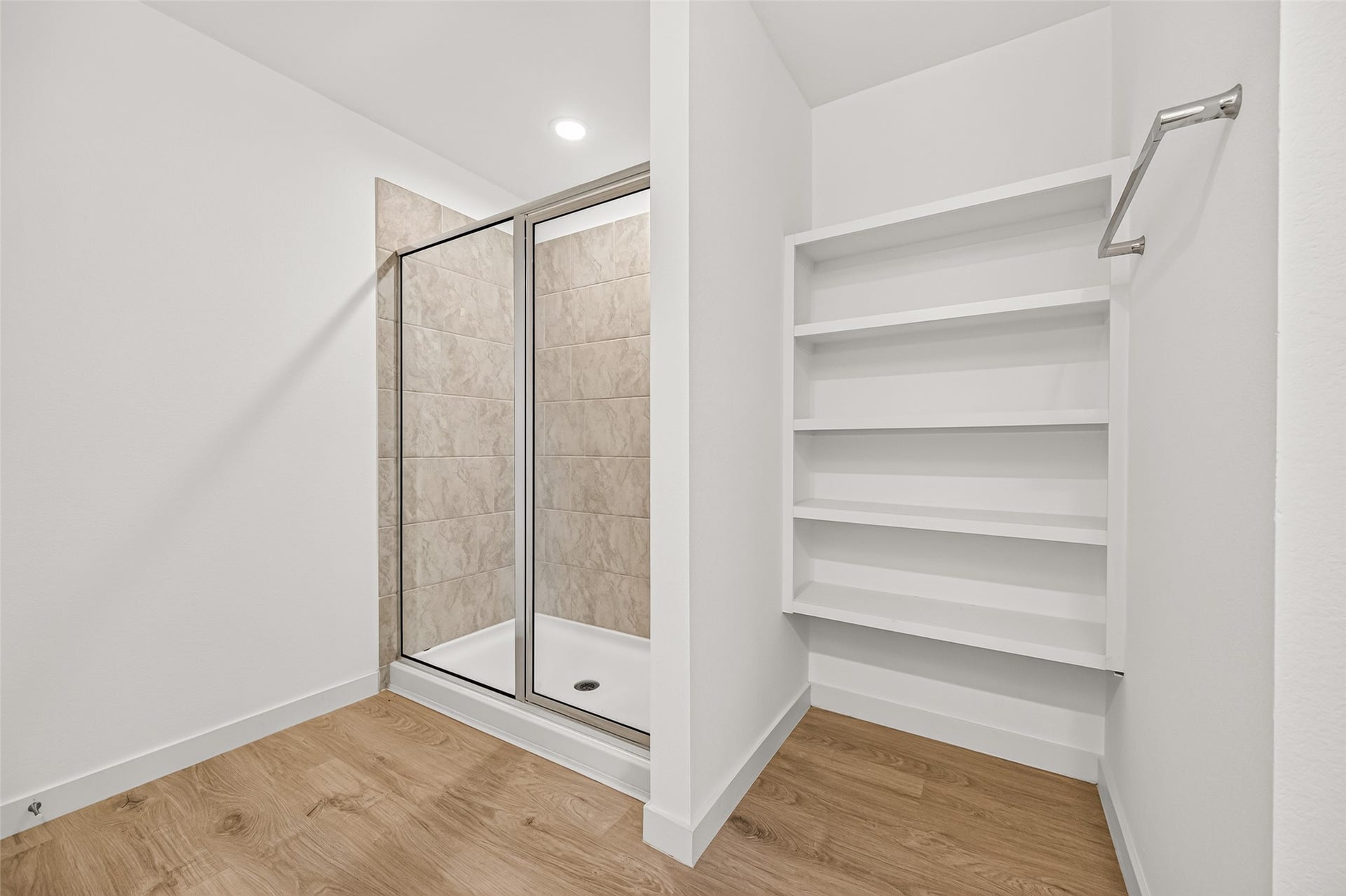 31742 Margaret Woods Lane, Fulshear, TX 77441 Walk-in shower, linen storage shelf, and towel rack.