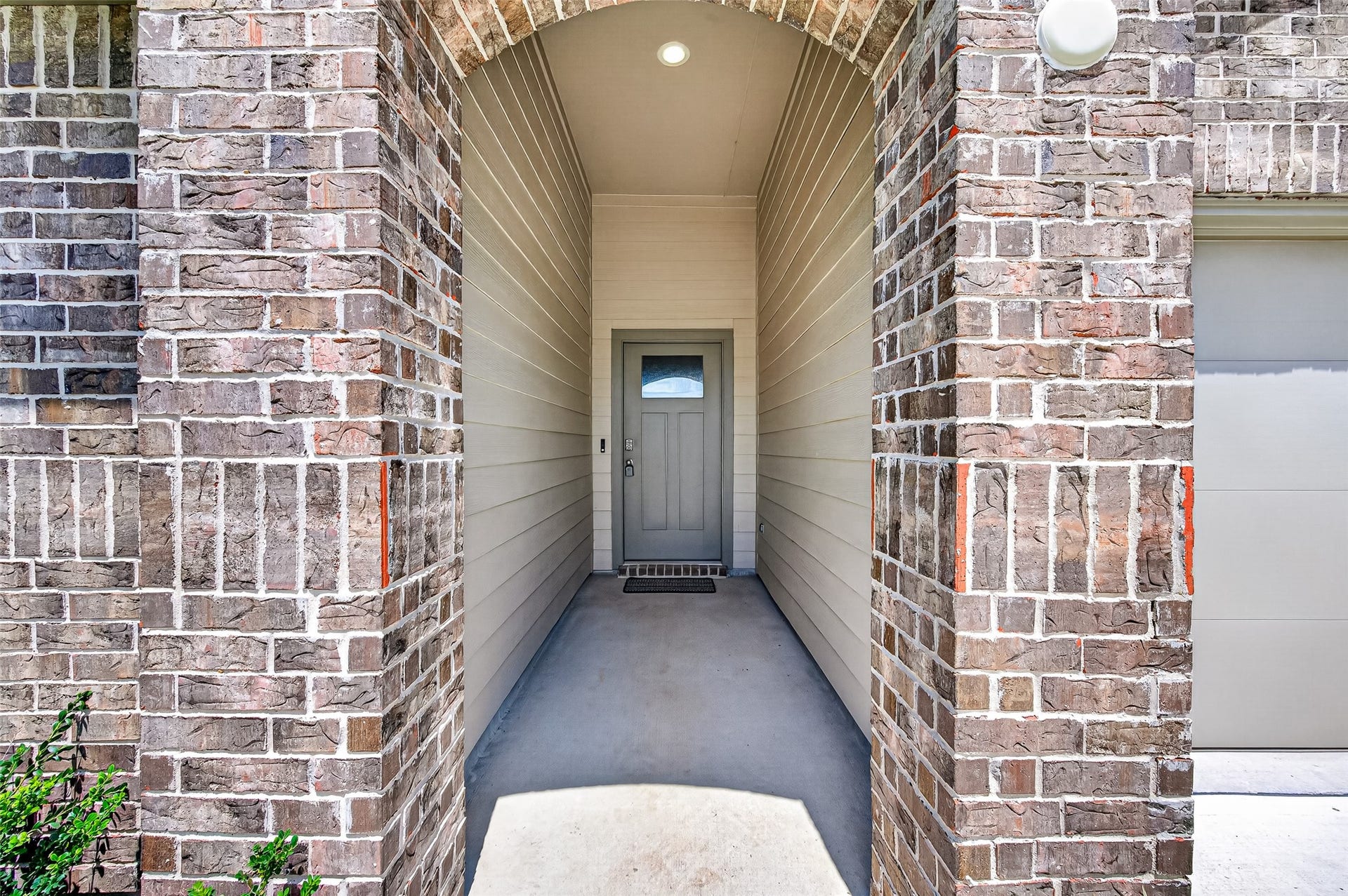 31742 Margaret Woods Lane, Fulshear, TX 77441 Covered porch entryway. Video doorbell.