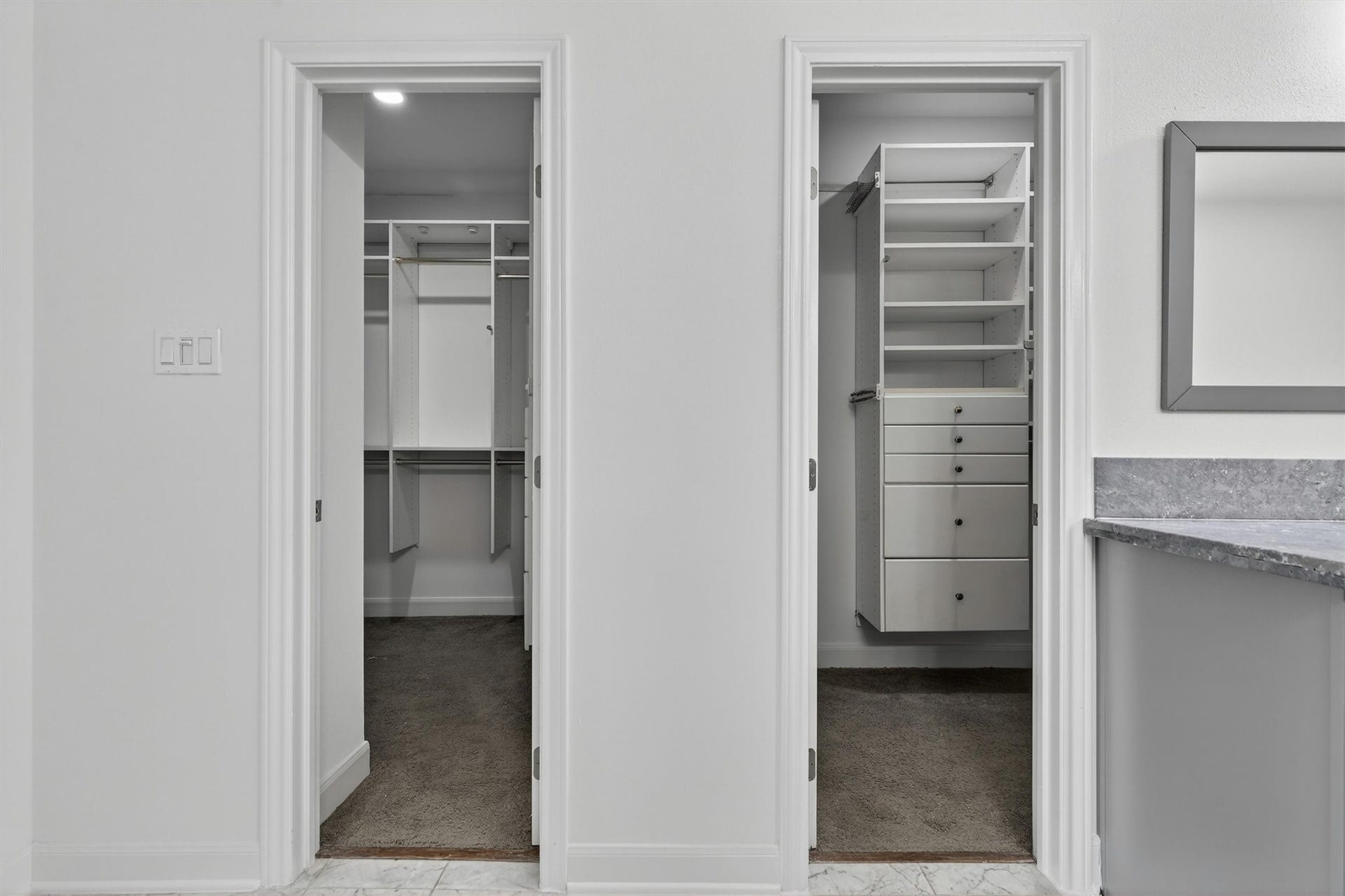 4720 Post Oak Timber Drive, #23, Houston, TX 77056 Dual custom walk-in closets with built-in shelving, drawers, and ample storage space provide exceptional organization in the luxurious primary suite. Thoughtfully designed closet systems offer both functionality and style, creating the perfect owners retreat buyers are searching for.