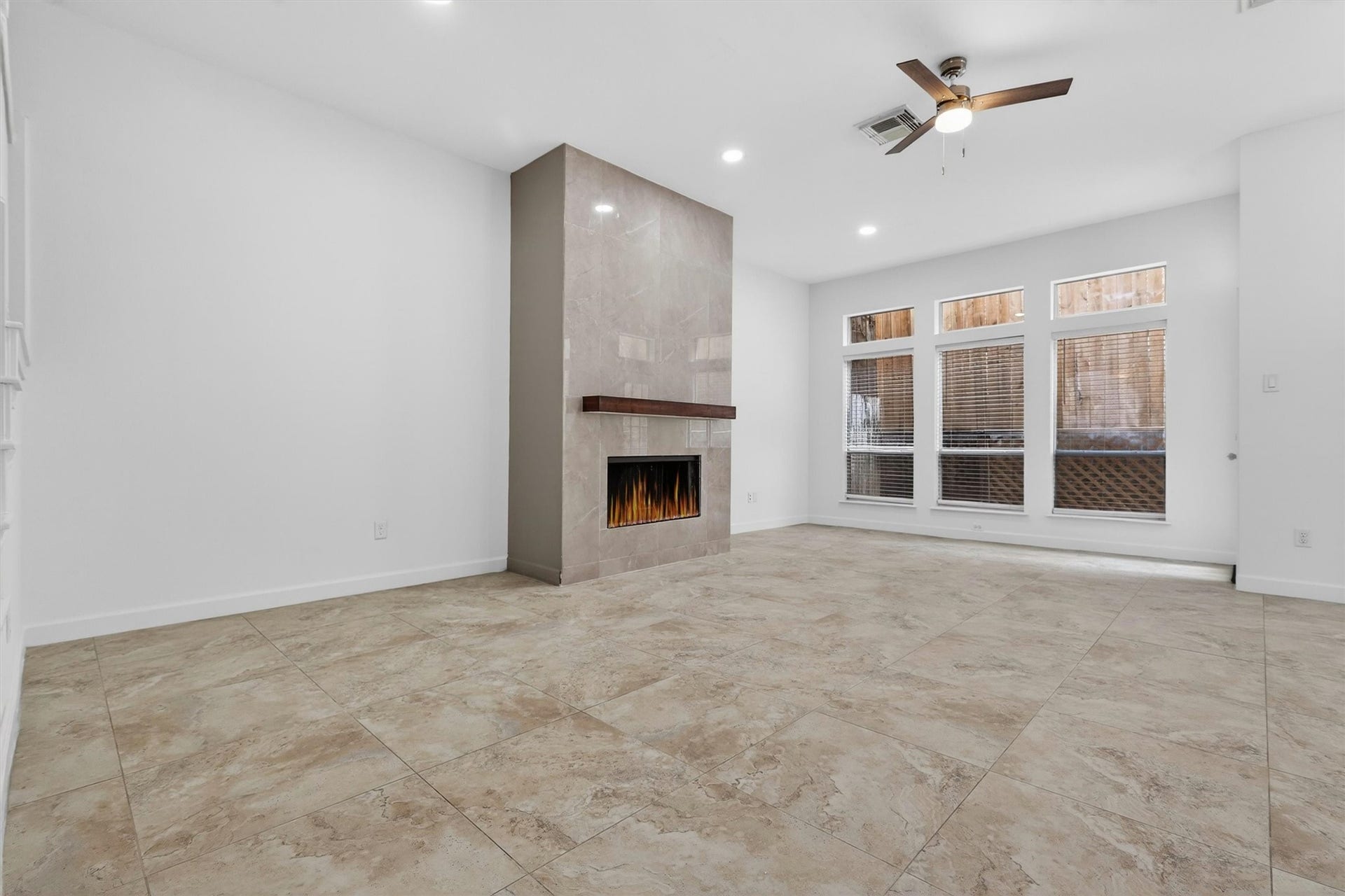 4720 Post Oak Timber Drive, #23, Houston, TX 77056 Designer porcelain fireplace feature wall adds warmth and sophistication to the living area.