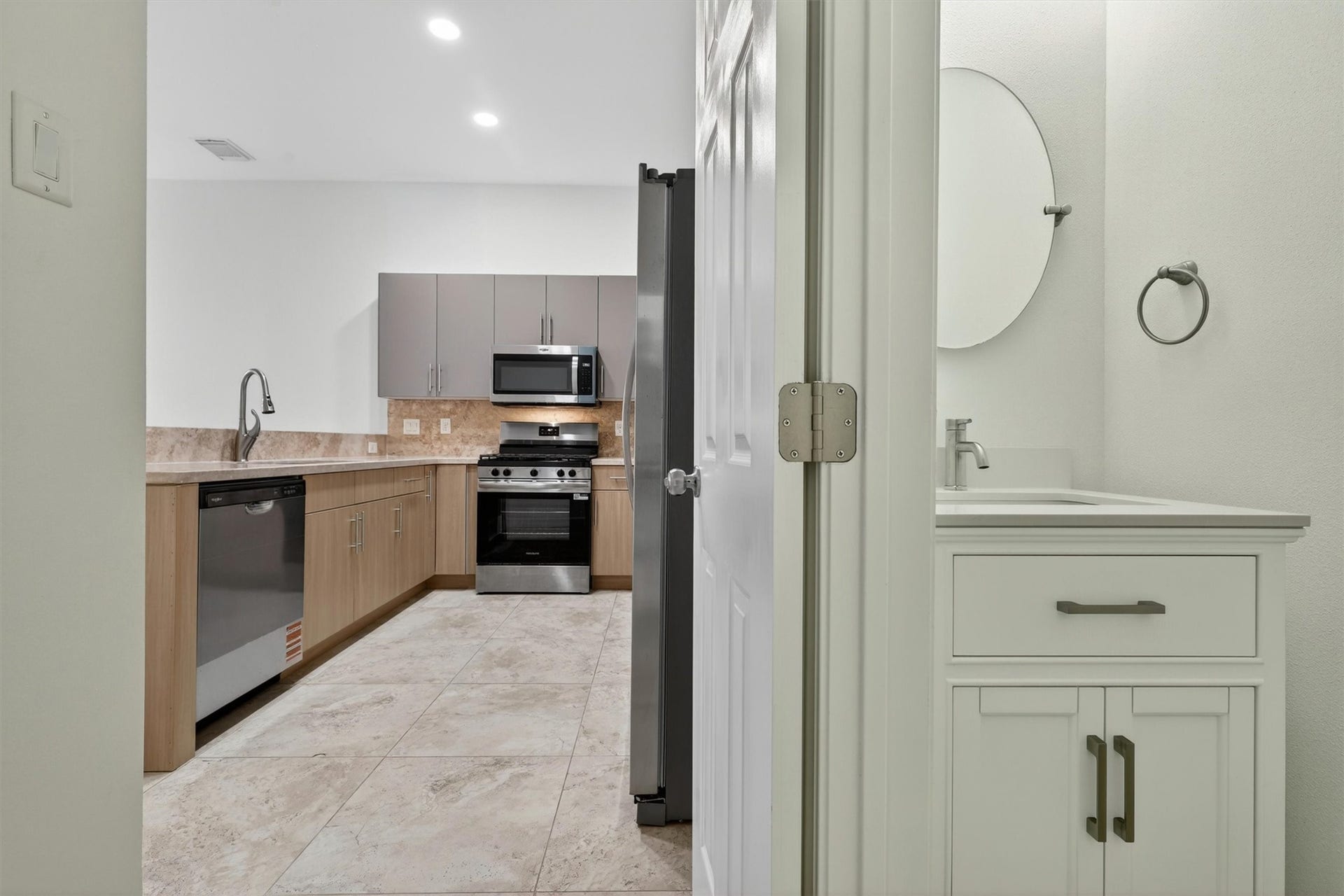 4720 Post Oak Timber Drive, #23, Houston, TX 77056 Soft-close cabinetry and premium storage solutions throughout the kitchen.