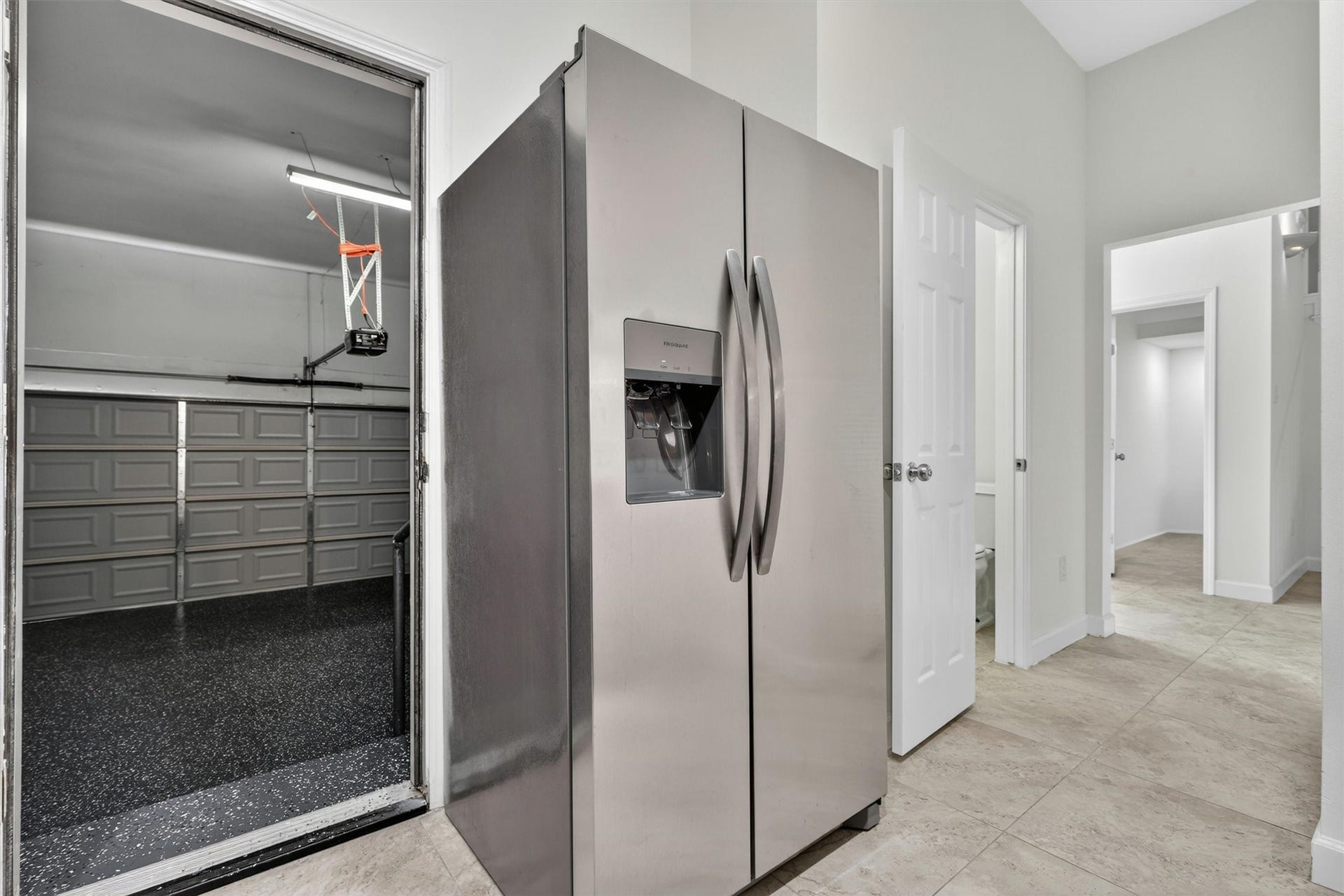 4720 Post Oak Timber Drive, #23, Houston, TX 77056 Professionally coated garage flooring designed for durability and upscale presentation.