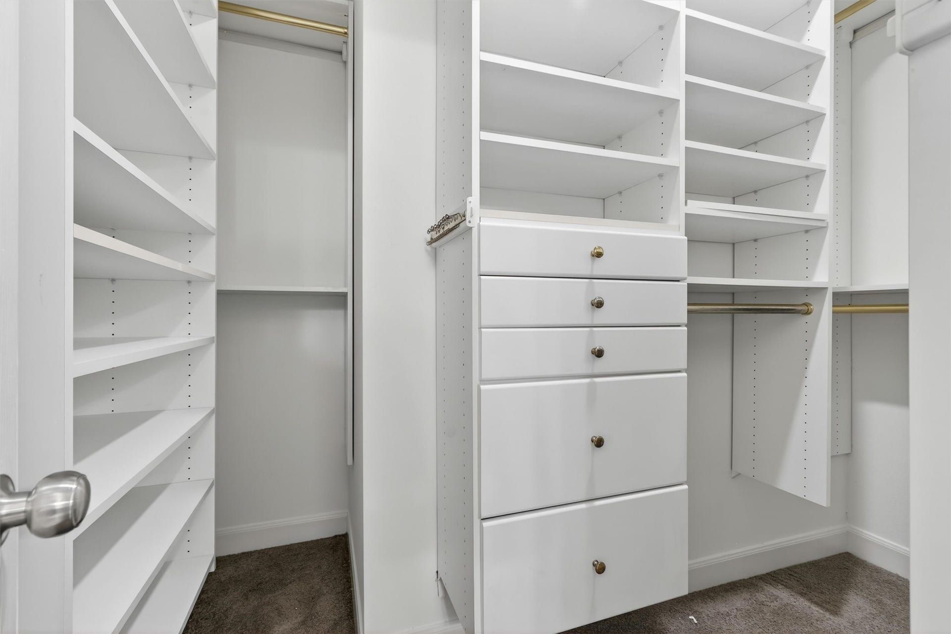 4720 Post Oak Timber Drive, #23, Houston, TX 77056 Custom built-in storage system designed for organization and convenience.