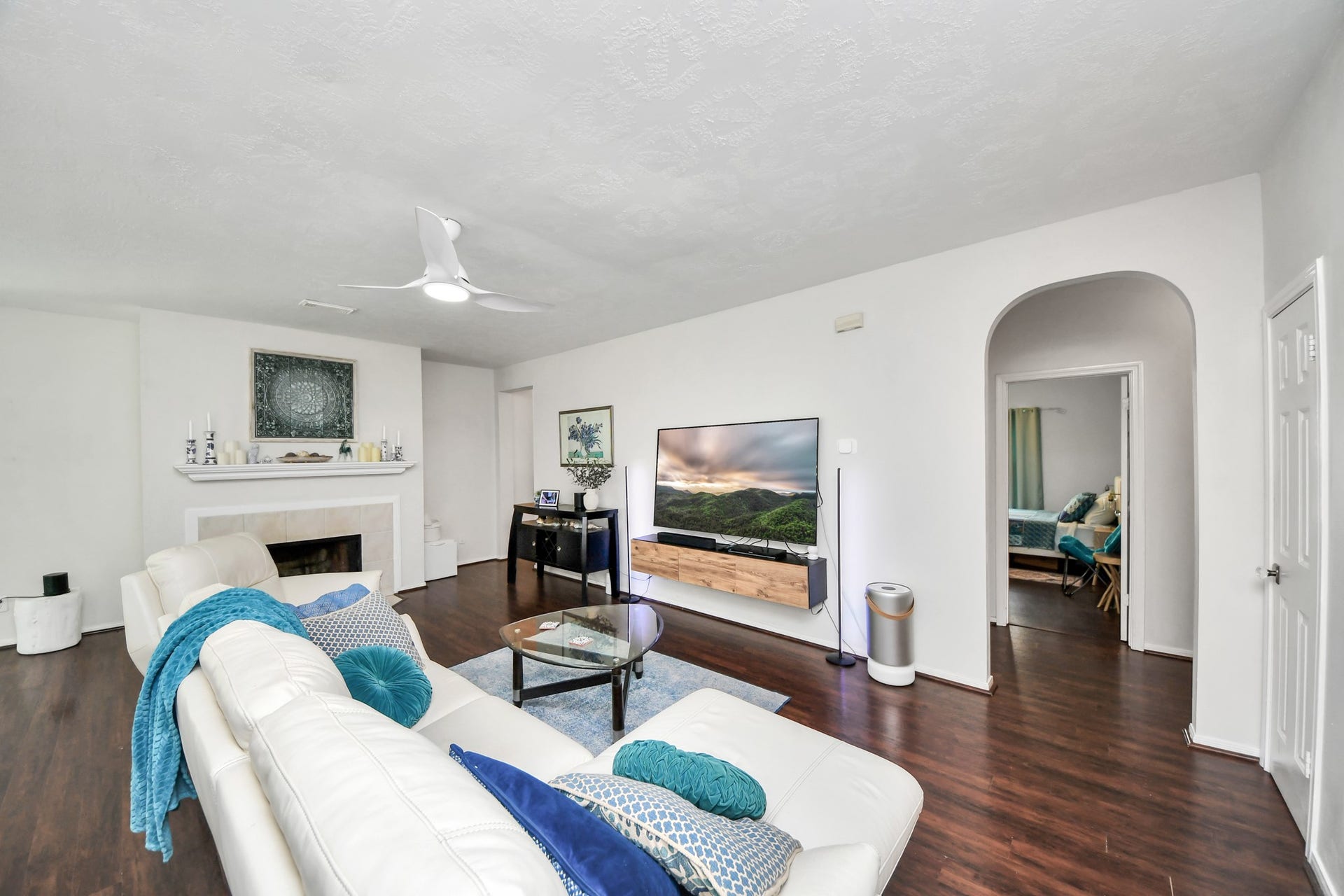 4634 Jaymar Dr, Sugar Land, TX 77479 The family room includes a fireplace, a large entertainment wall, and flexible seating space.