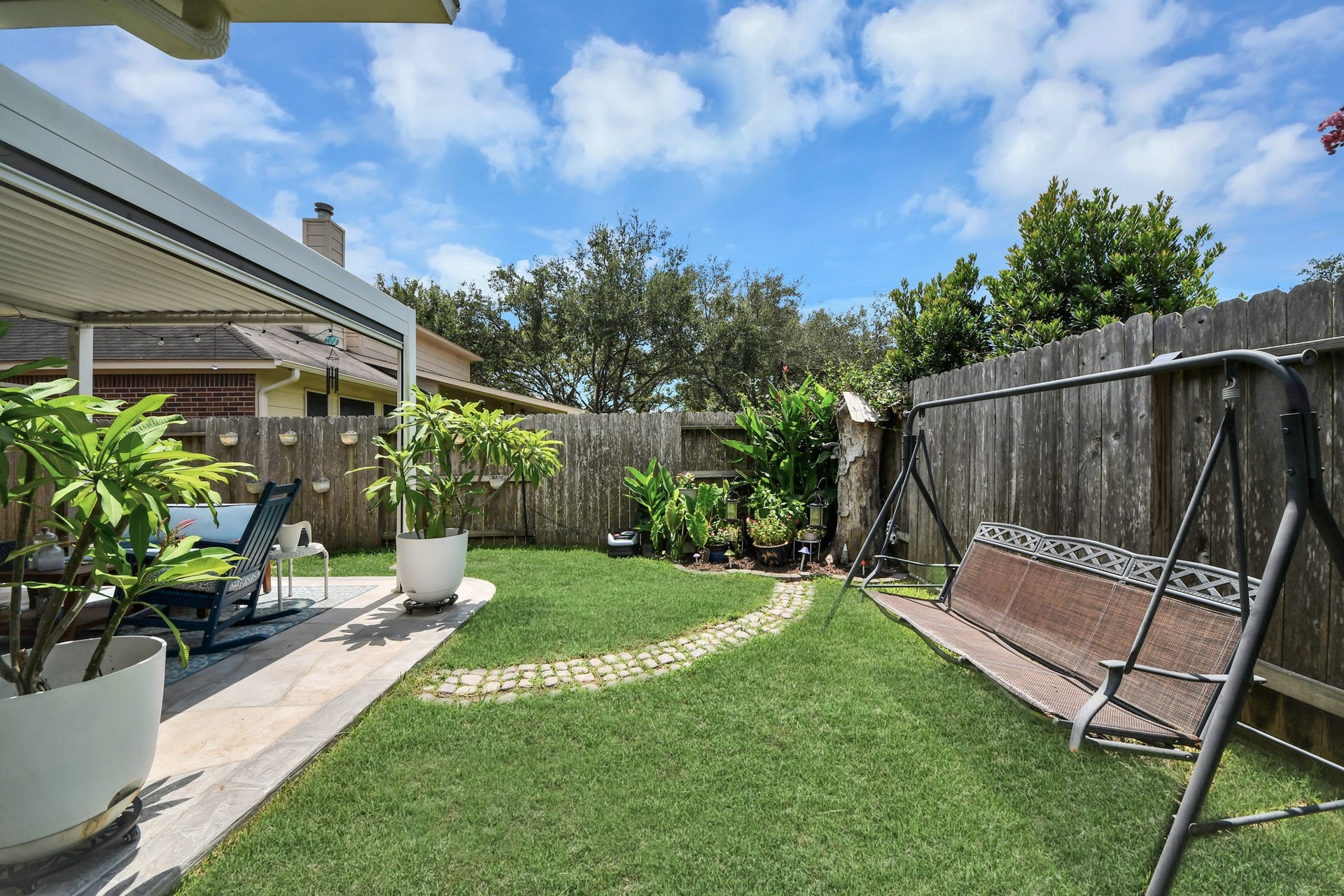 4634 Jaymar Dr, Sugar Land, TX 77479 Fully fenced backyard offering green space for recreation, gardening, or pets.