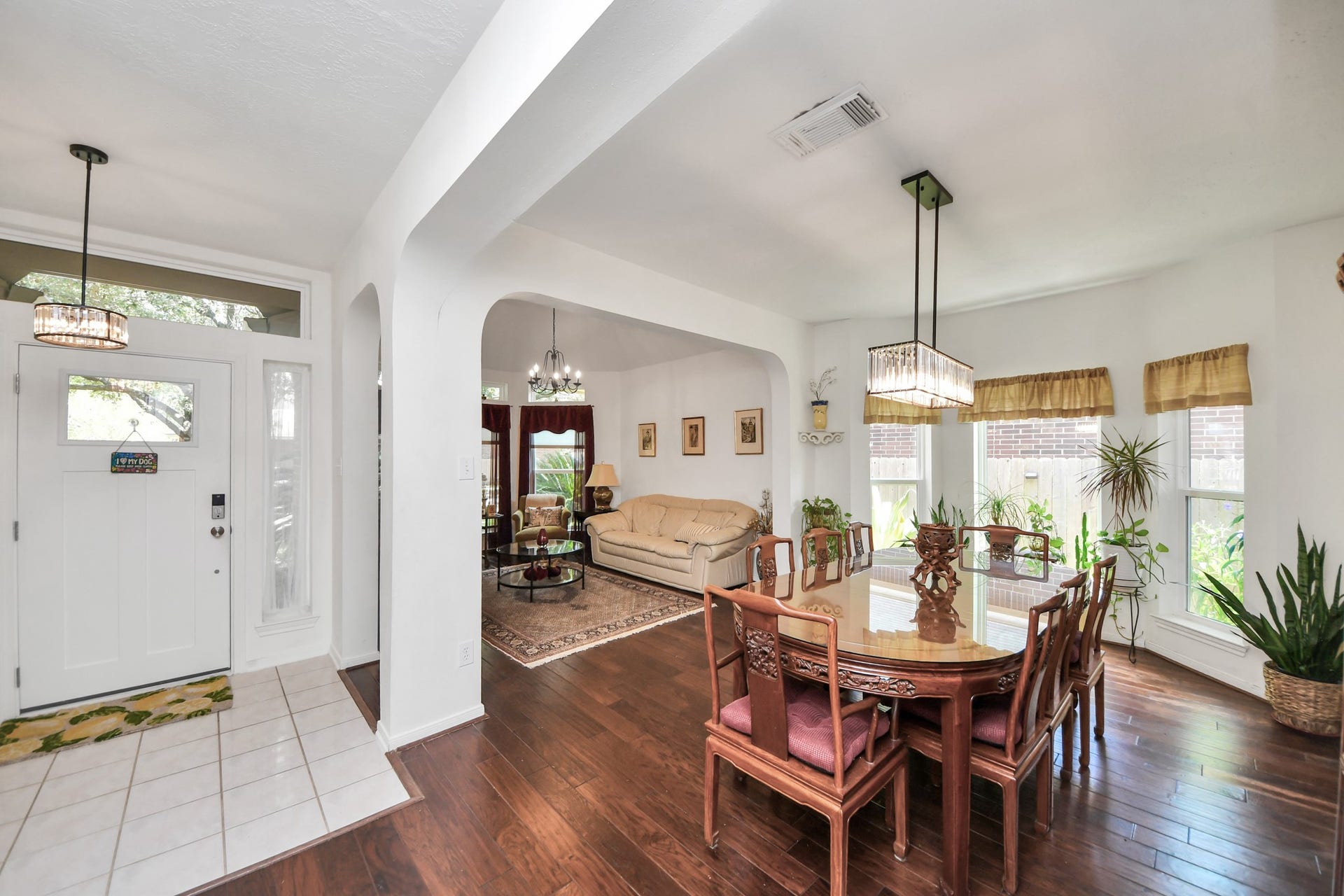 4634 Jaymar Dr, Sugar Land, TX 77479 The front entry opens to the formal dining and living areas through beautiful arched openings.