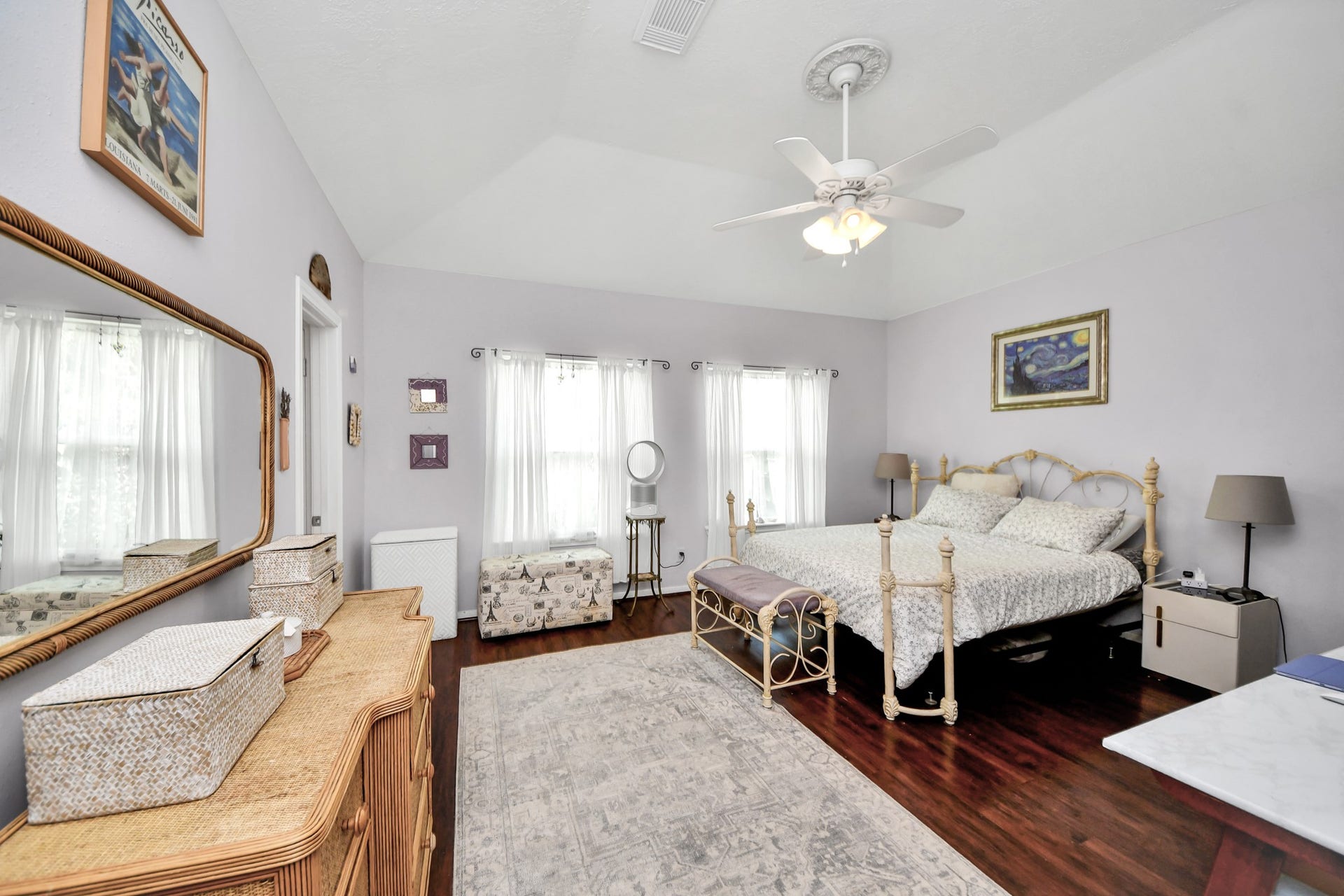 4634 Jaymar Dr, Sugar Land, TX 77479 The oversized primary bedroom has a raised ceiling, multiple windows, and room for a sitting or work area.