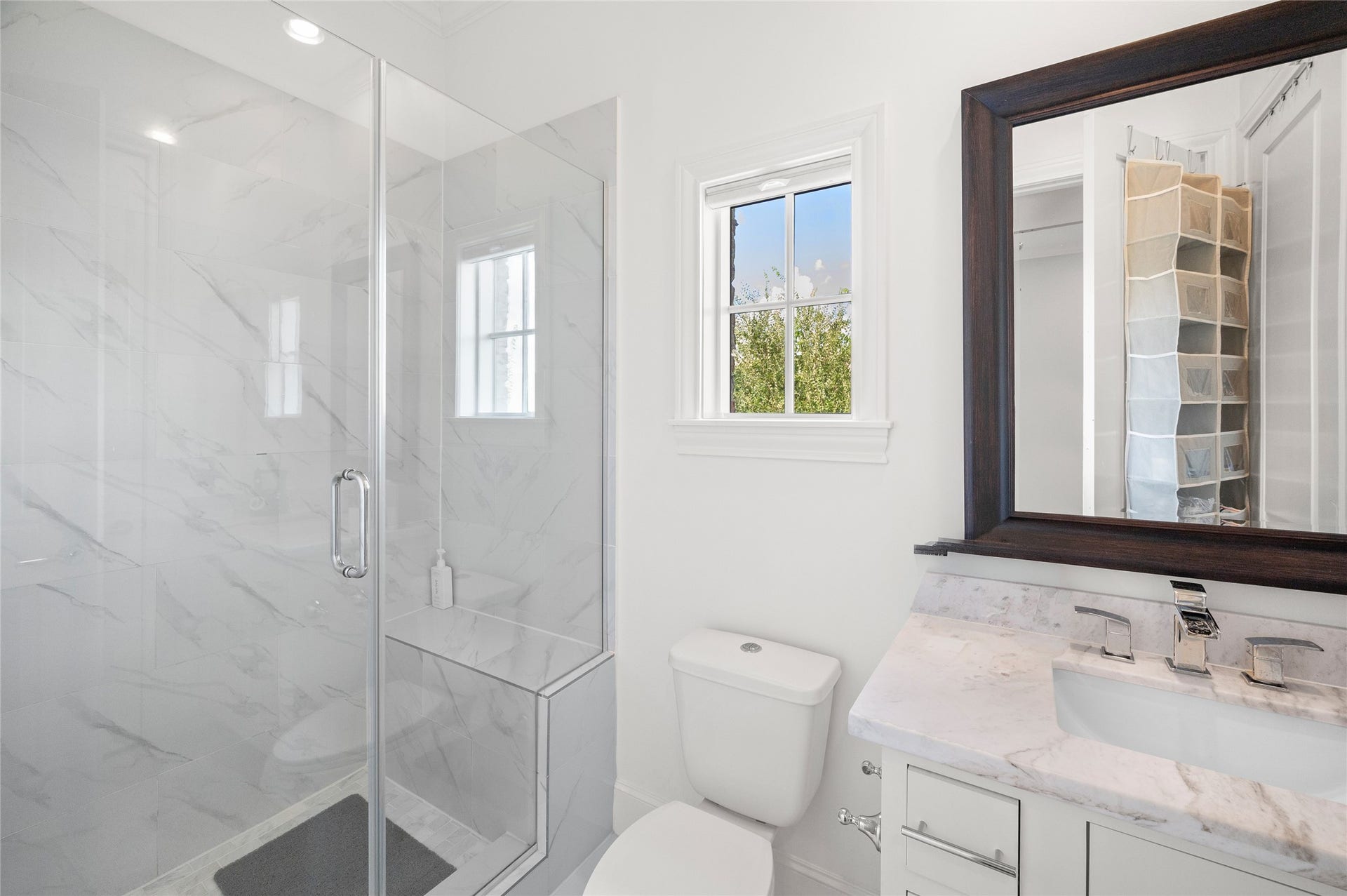 7554 Little Caprese Lane, Houston, TX 77055 En-suite bath with standing glass shower and marble countertop.