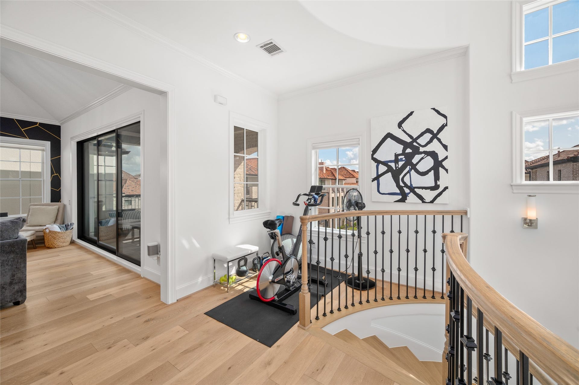 7554 Little Caprese Lane, Houston, TX 77055 Comfortable secondary living area with expansive sliding glass doors opening to a covered balcony.