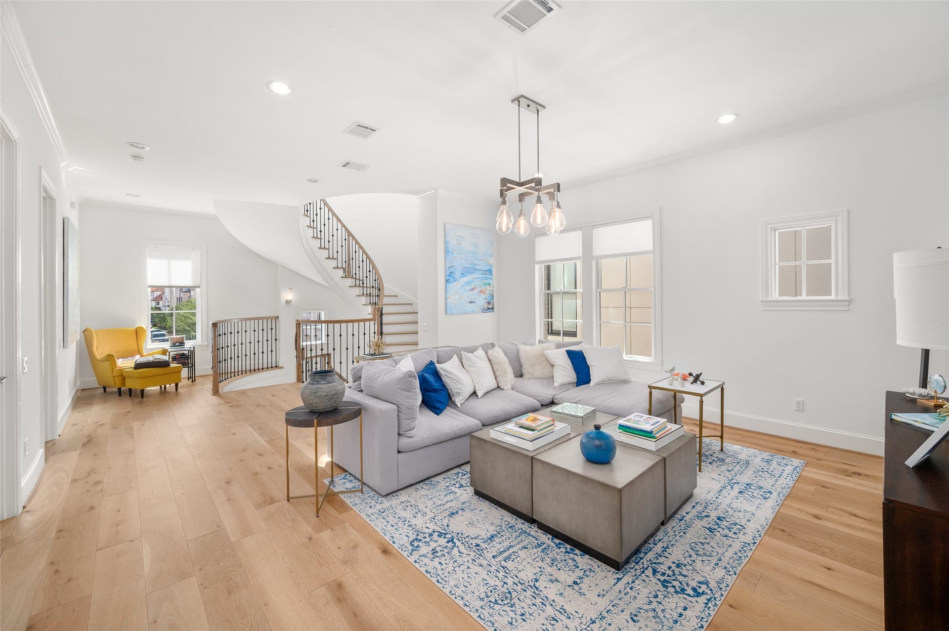 7554 Little Caprese Lane, Houston, TX 77055 Open and comfortable gathering space with generous natural light, hardwood floors, and ample room for seating.