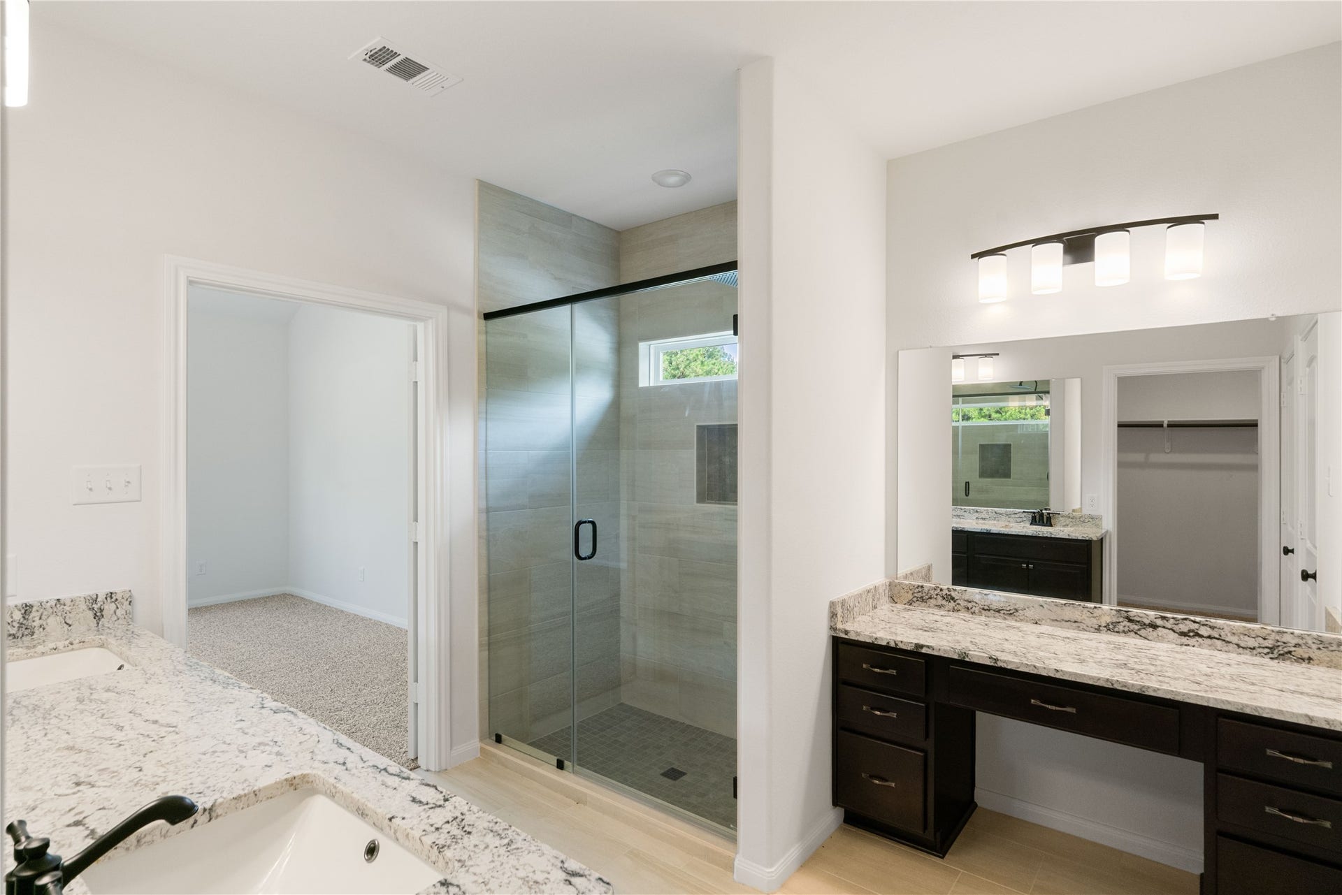 21203 Peach Wood Court, Cleveland, TX 77328 Another view of the primary bath. Vanity area and over sized shower