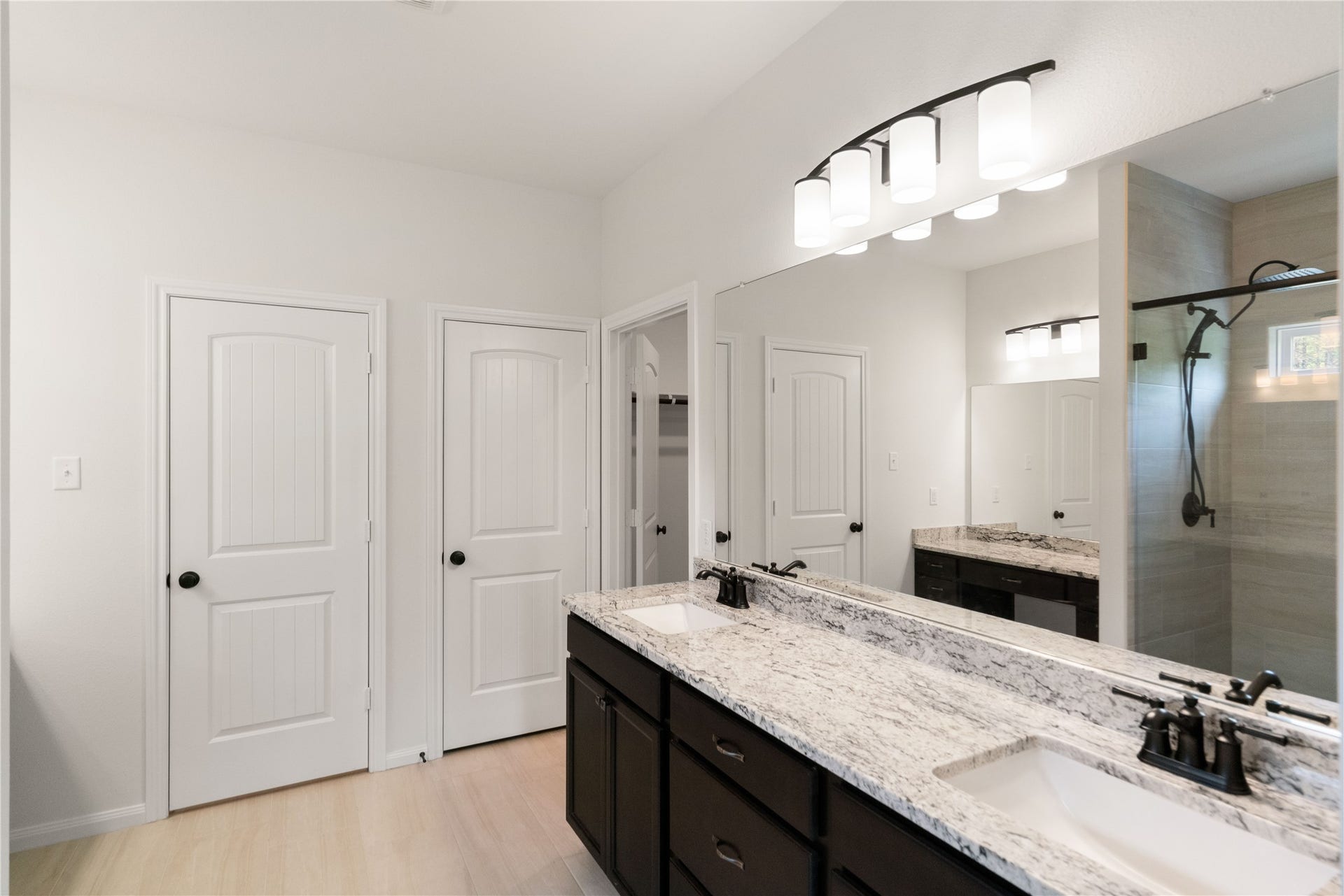 21203 Peach Wood Court, Cleveland, TX 77328 Primary bath wiith double sinks, linen closet and water room.