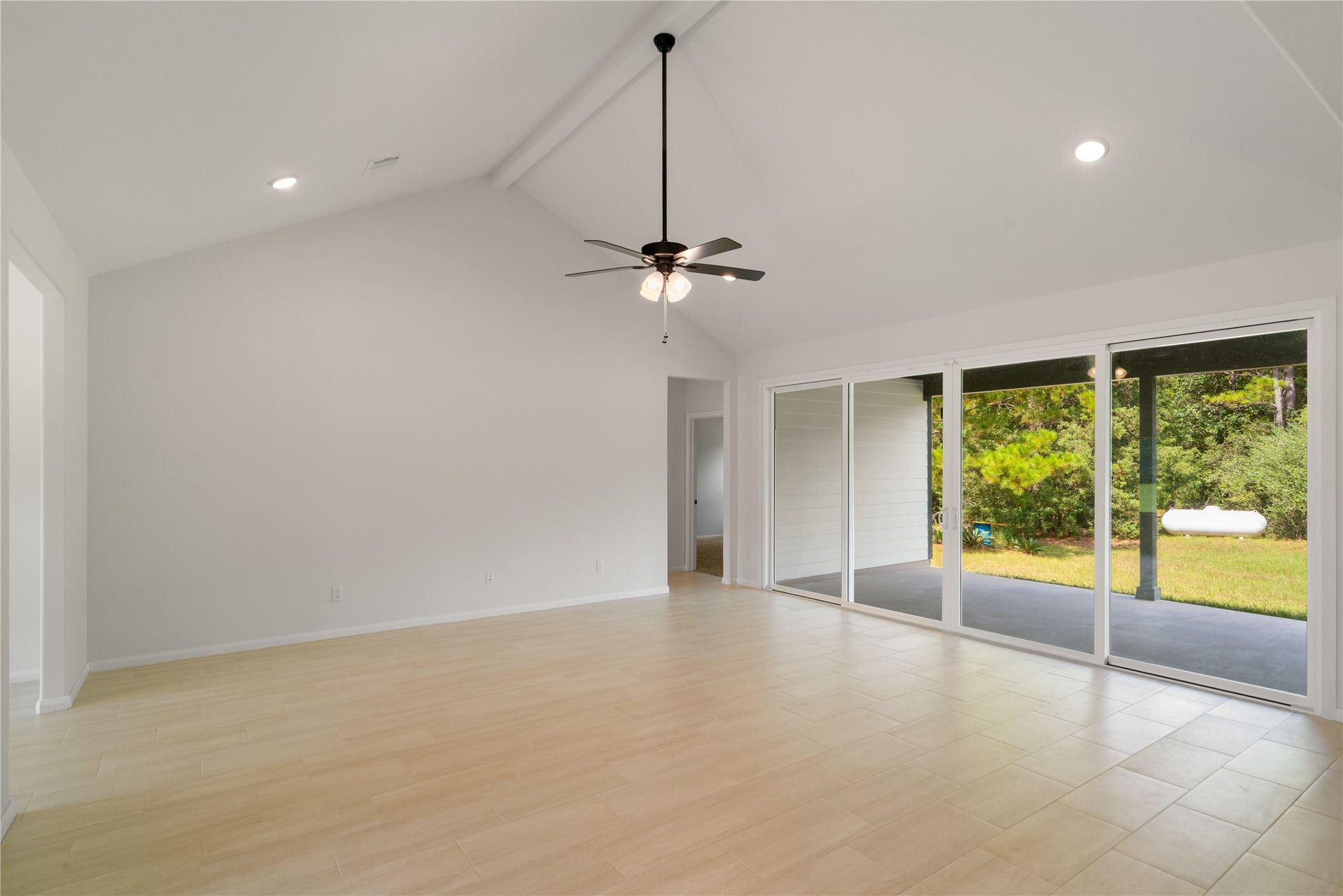 21203 Peach Wood Court, Cleveland, TX 77328 Another view of living room. Sliding doors both open