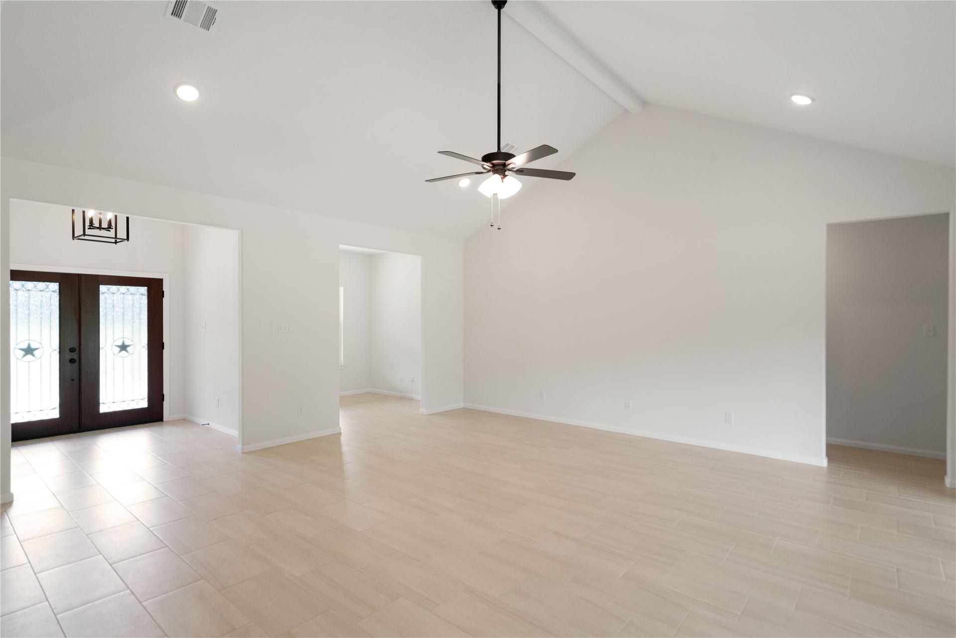 21203 Peach Wood Court, Cleveland, TX 77328 Another view of the living room and entry way.