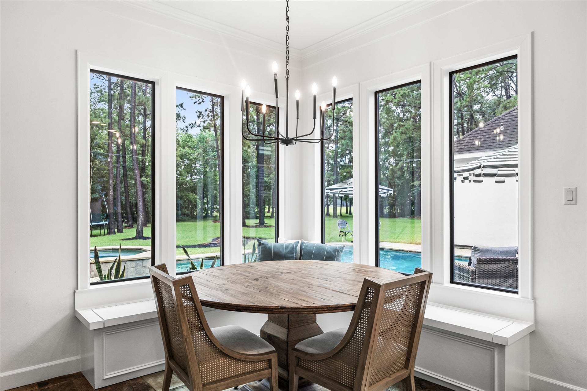 3810 Benders Lane, Spring, TX 77386 Custom built-in bench seating and expansive windows make the breakfast area both inviting and functional.