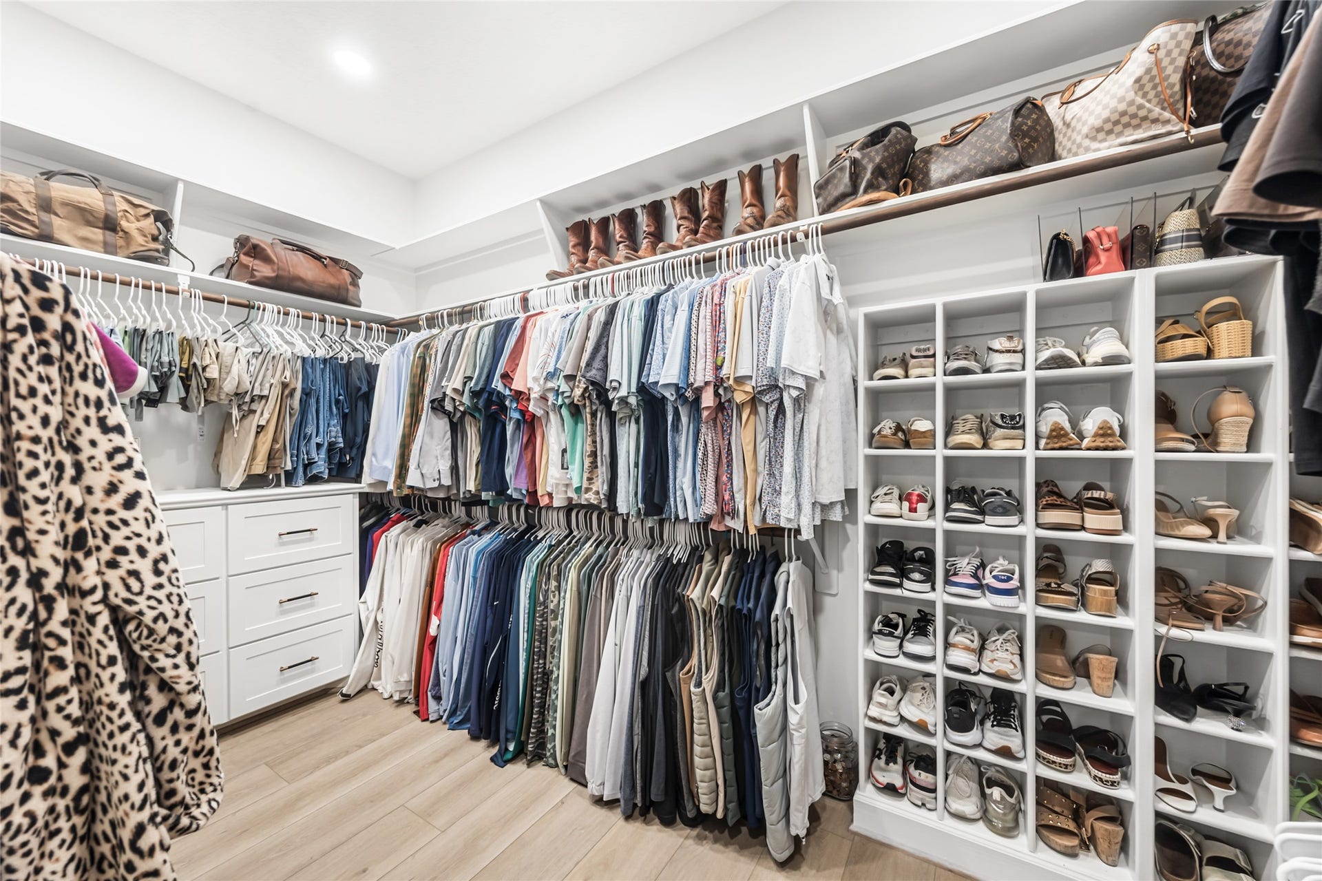 3810 Benders Lane, Spring, TX 77386 Expansive walk-in primary closet provides ample storage and functionality with room to organize and display your wardrobe.