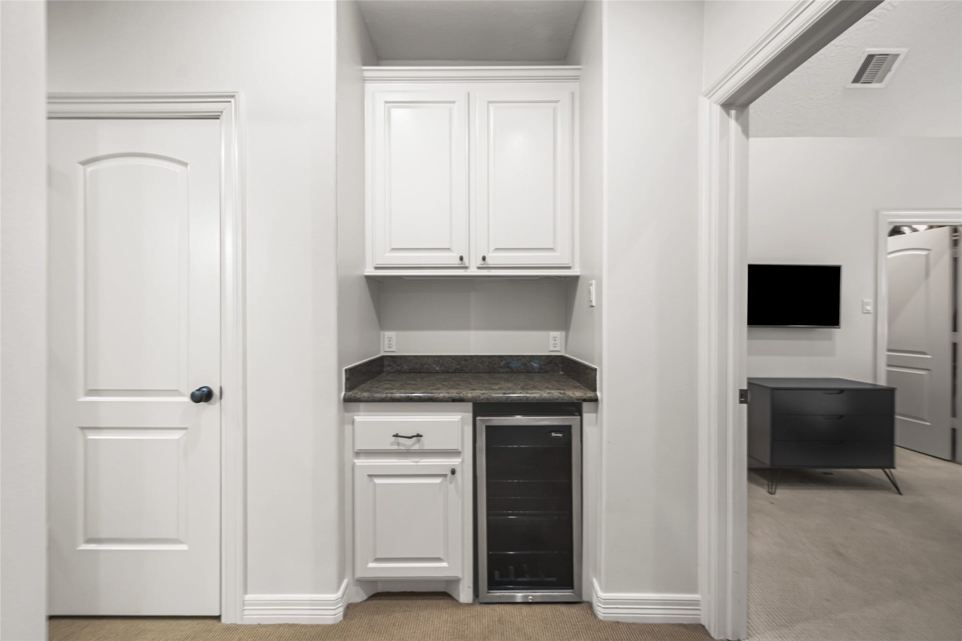 3810 Benders Lane, Spring, TX 77386 Upstairs storage area features built-in cabinetry and countertop space, providing a convenient spot for organization, hobbies, or everyday essentials.