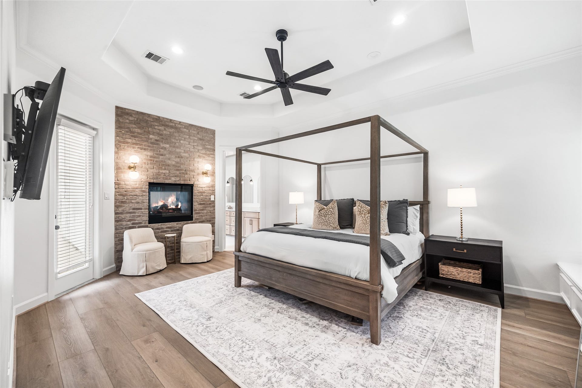 3810 Benders Lane, Spring, TX 77386 The renovated primary suite offers a peaceful retreat with a fireplace, direct access to the backyard, and a spa-inspired bathroom.