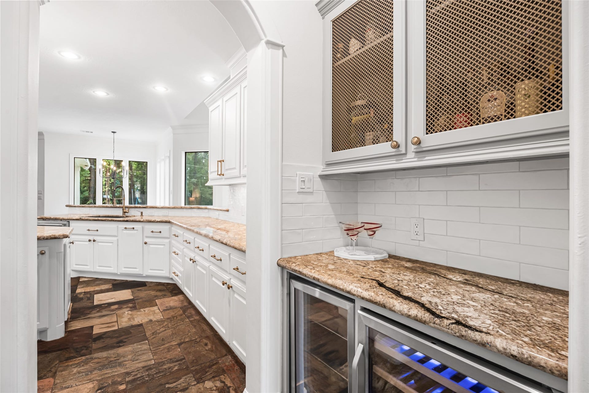 3810 Benders Lane, Spring, TX 77386 Beautifully appointed dry bar featuring built-in storage and seamless access to the dining room, ideal for gatherings and special occasions.