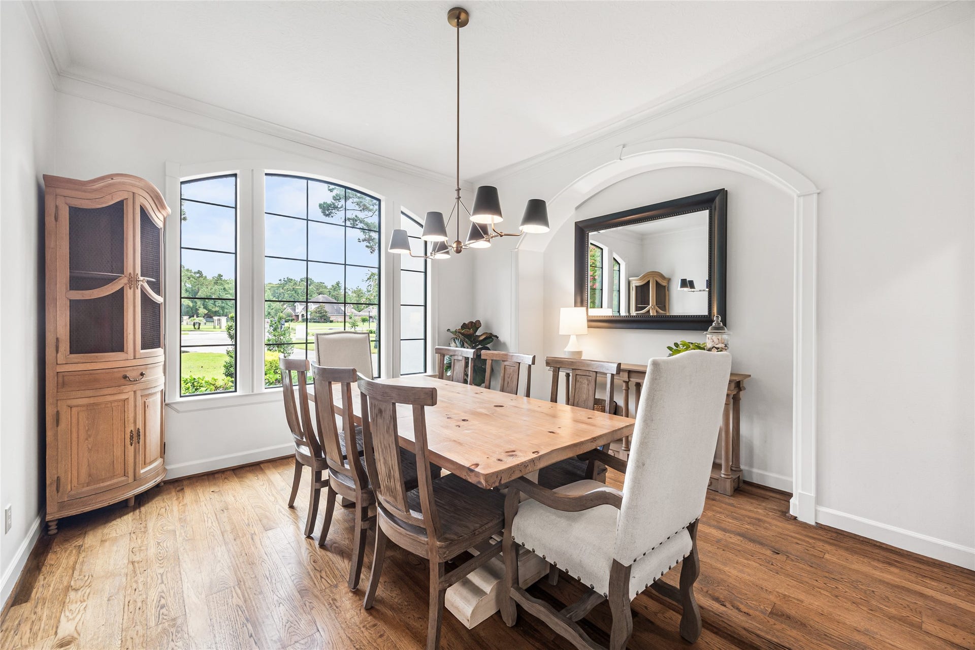3810 Benders Lane, Spring, TX 77386 Bright and welcoming dining room showcases large windows, a spacious layout, and a seamless blend of comfort and elegance.