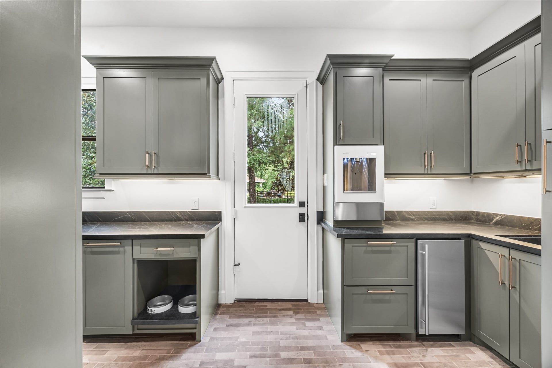 3810 Benders Lane, Spring, TX 77386 The utility room youve always dreamed of! Thoughtfully designed with an ice maker, water dispenser, dedicated ironing board drawer, oversized cup storage, and custom features to simplify everyday living.