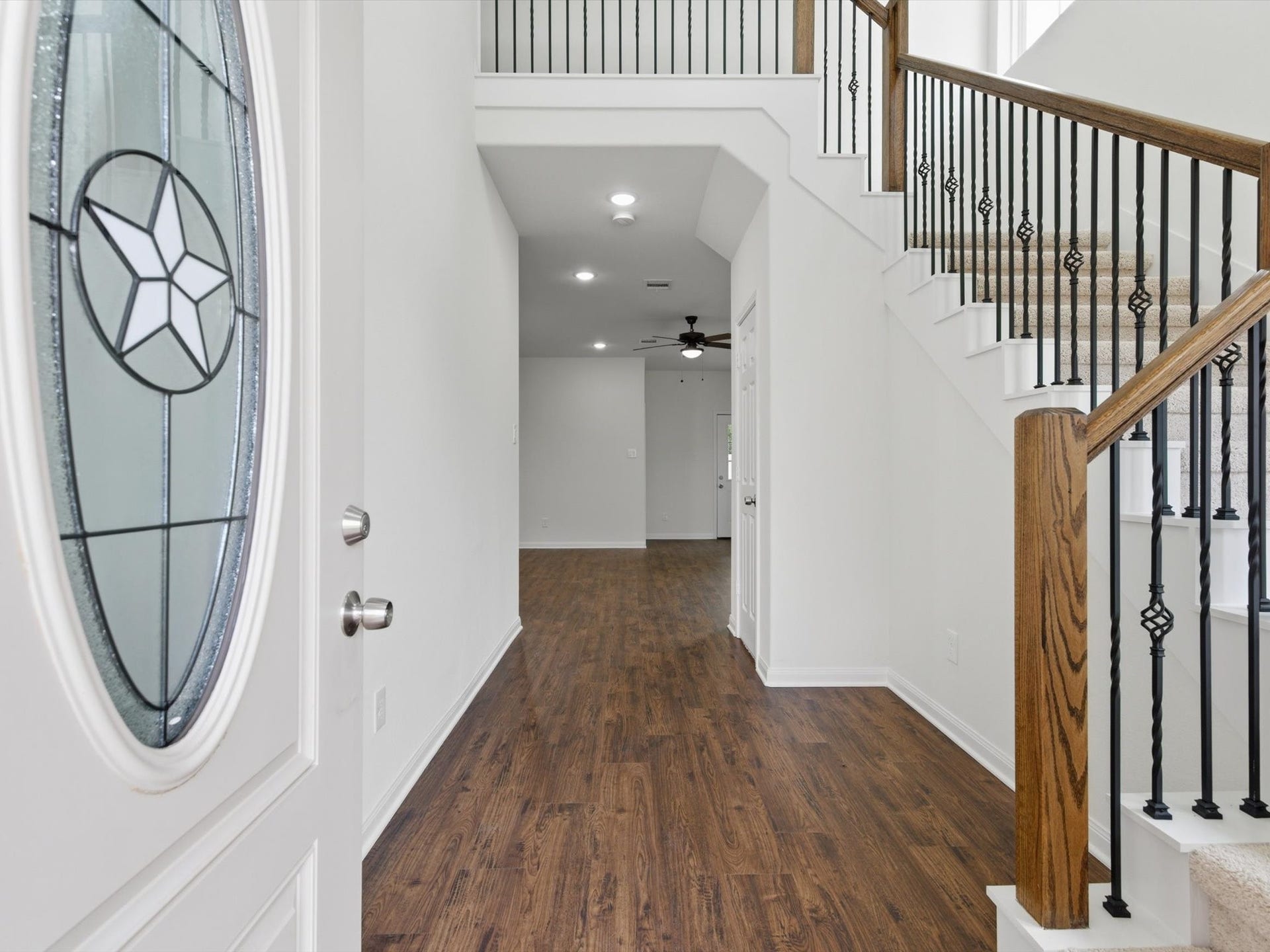 Step inside to soaring ceilings and sleek vinyl plank flooring that create an immediate sense of space, style, and durability from the moment you enter.