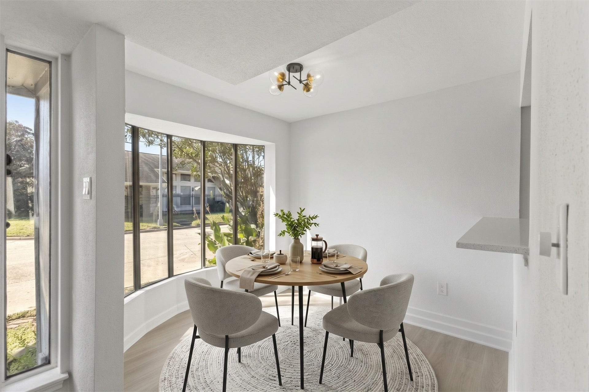1913 Bittercreek Drive, Houston, TX 77042 The breakfast area offers a cozy, light-filled spot for everyday meals, framed by a stunning curved bay window. Virtually staged.