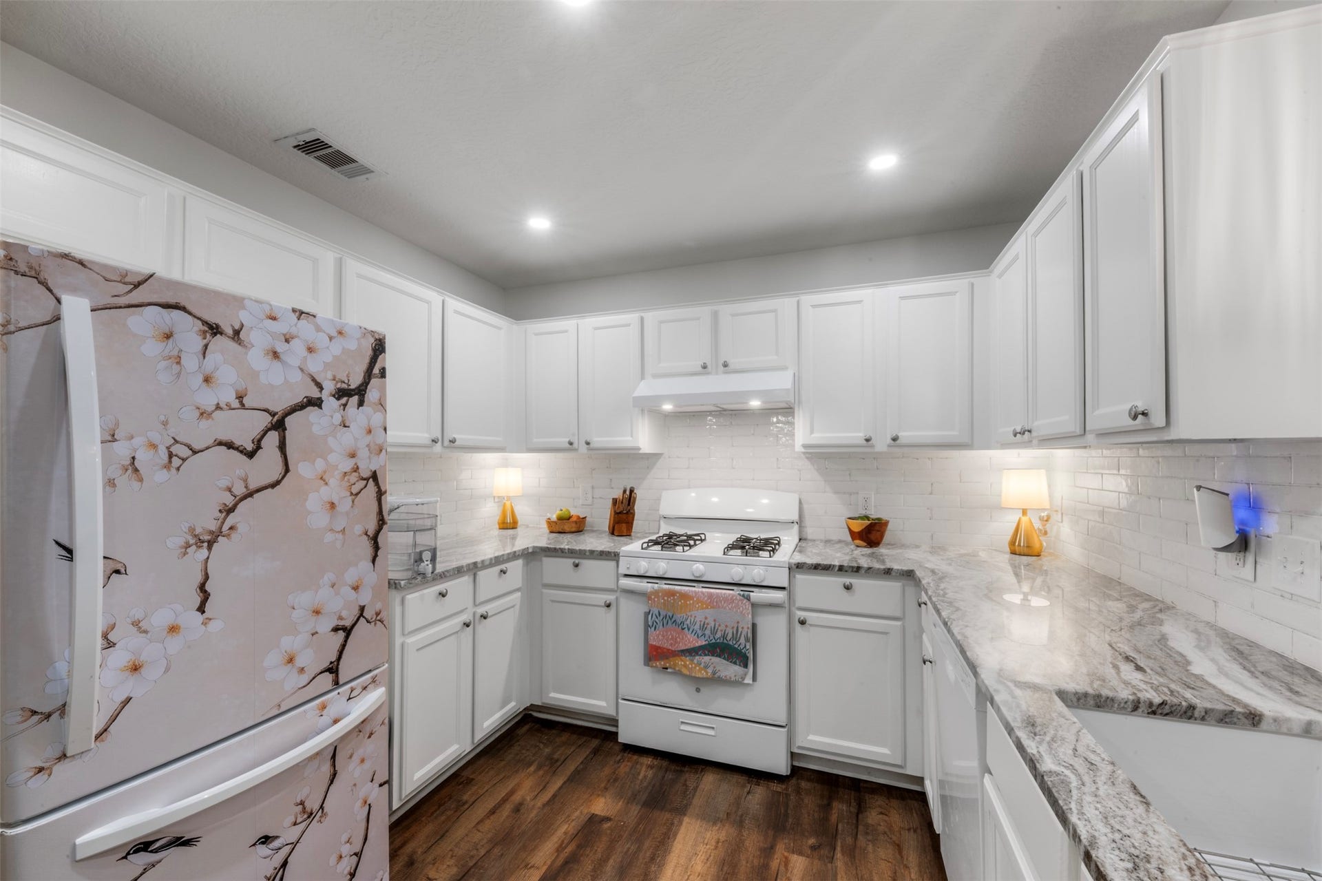 9750 Gulfstream Drive, Conroe, TX 77303 Another view of this wonderful kitchen with white cabinetry, ample storage and granite countertops.