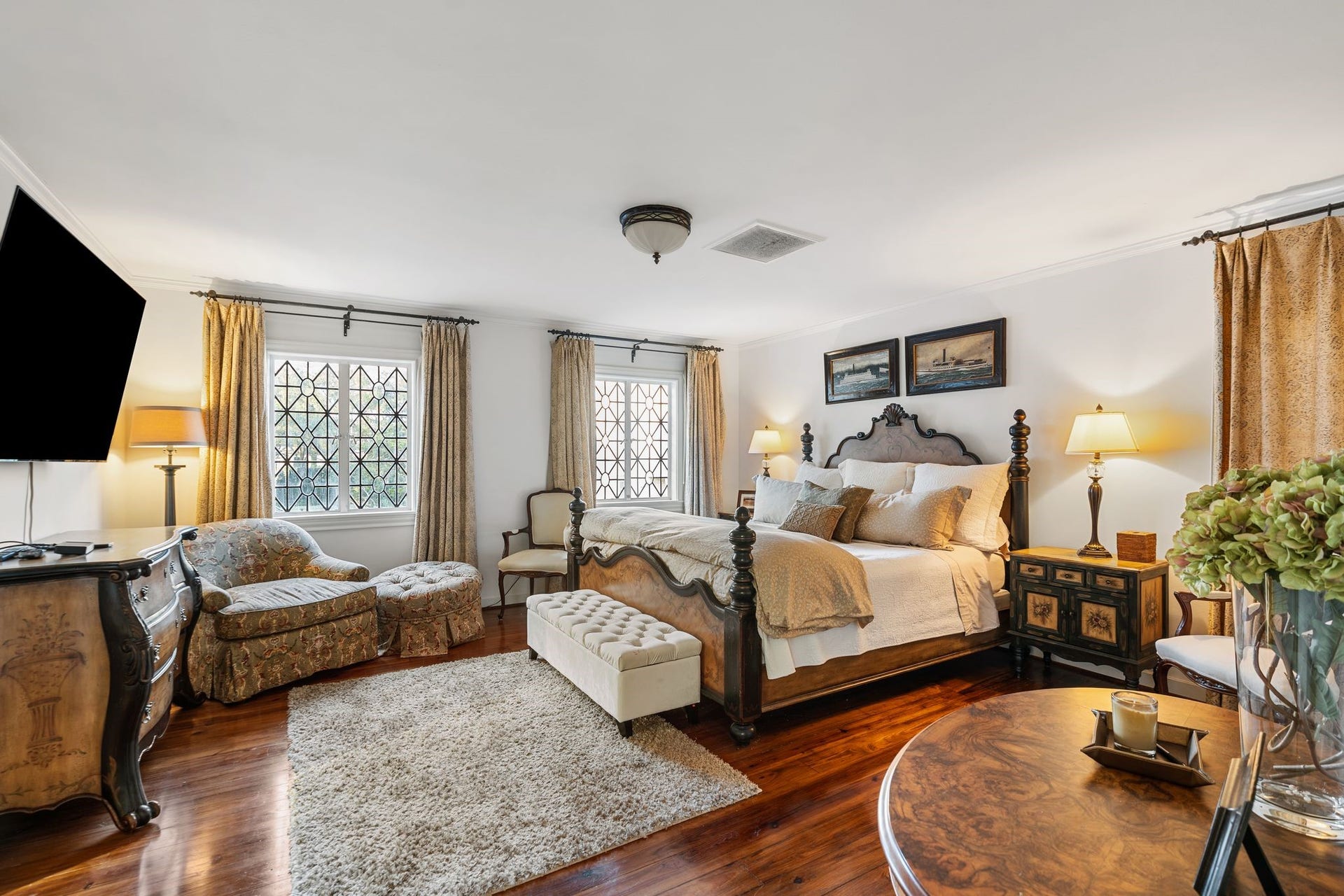 [Garage Apartment Bedroom]
Light-filled bedroom has windows overlooking the driveway.