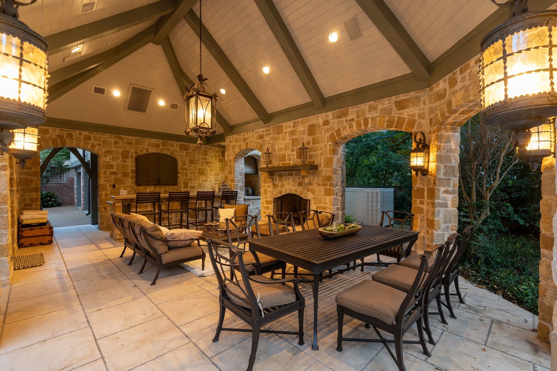 [Pavilion]
Beneath an exposed-beam cathedral ceiling, this inclusive space provides all the amenities for gracious, outdoor living and entertaining, including multiple seating and dining areas, under-counter refrigerator, a DCS grill, and abundant storage.